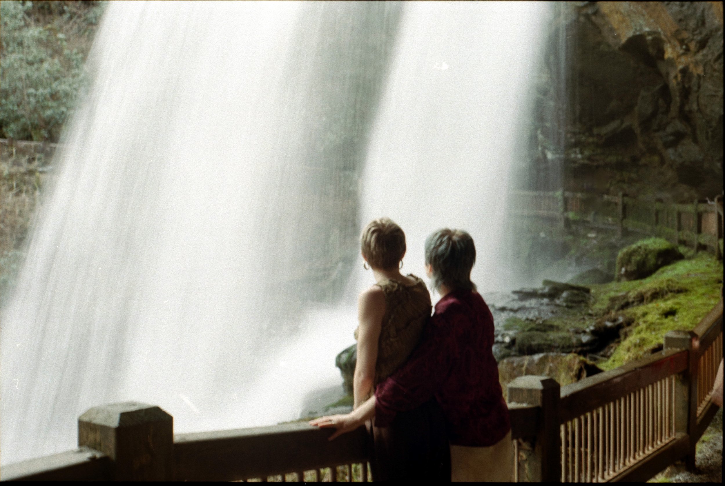 couple engagement session at a waterfall highlands nc dry falls