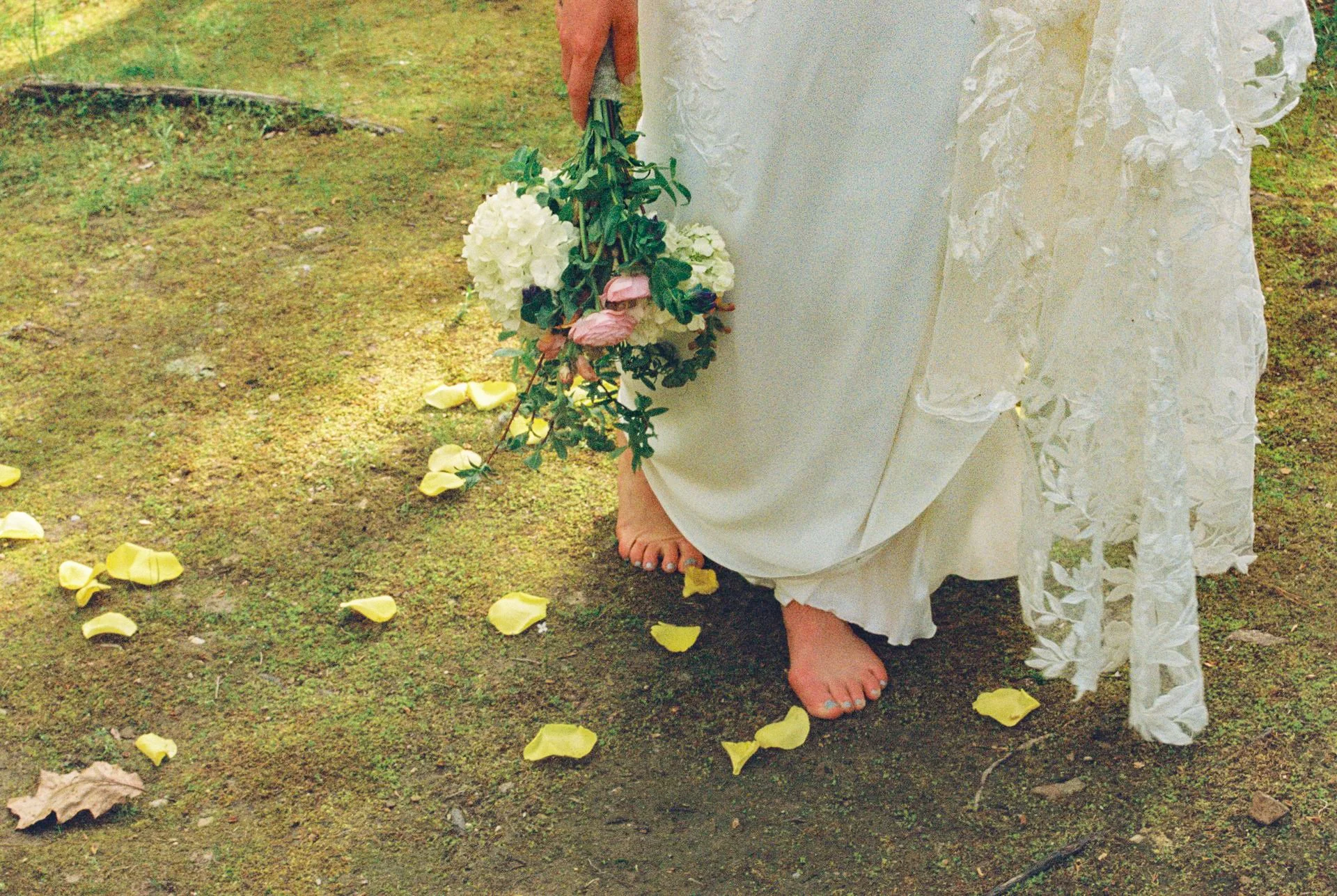 bride walking barefoot during wedding ceremony