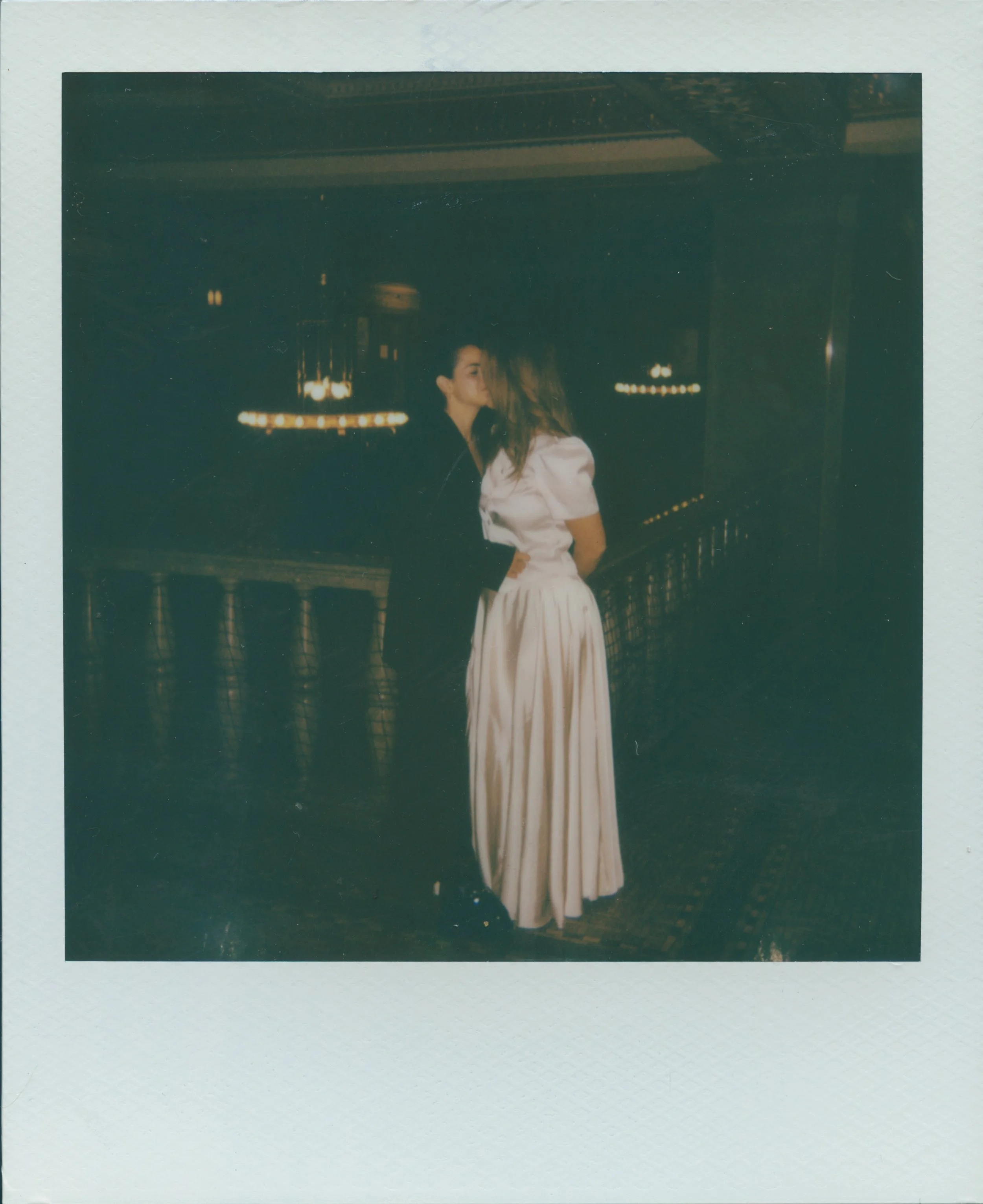 polaroid keepsake of couple kissing at the Asheville courthouse