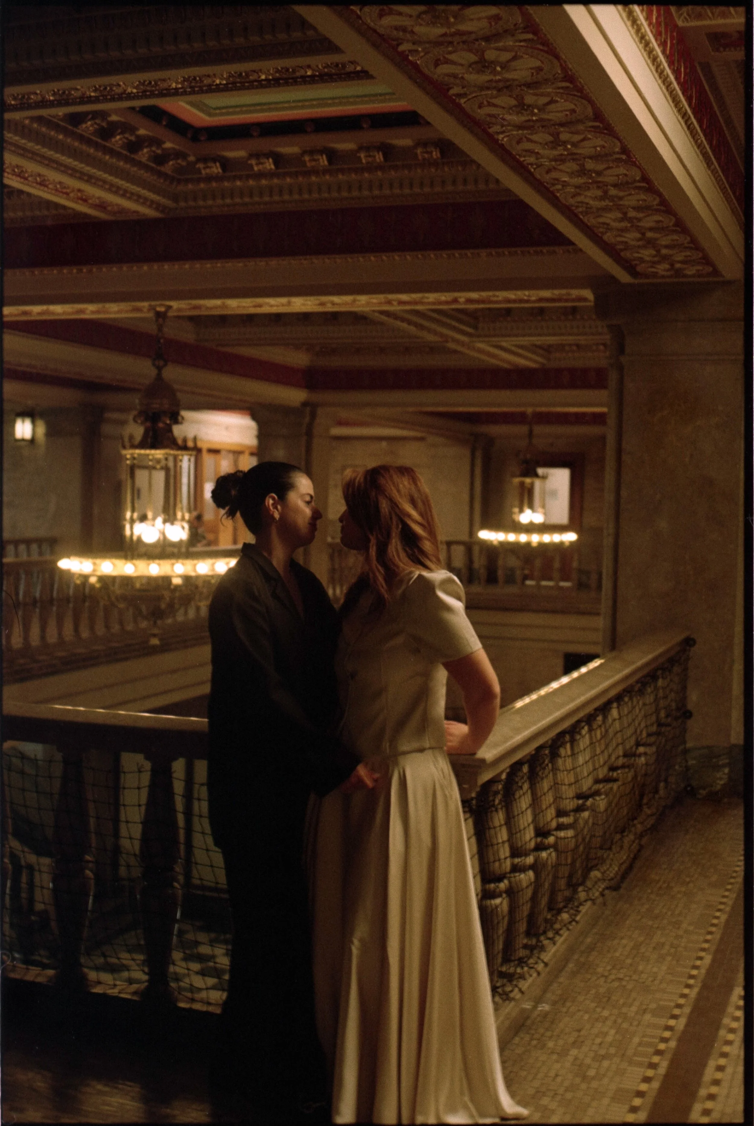 couple lovingly embracing each other at the downtown Asheville courthouse
