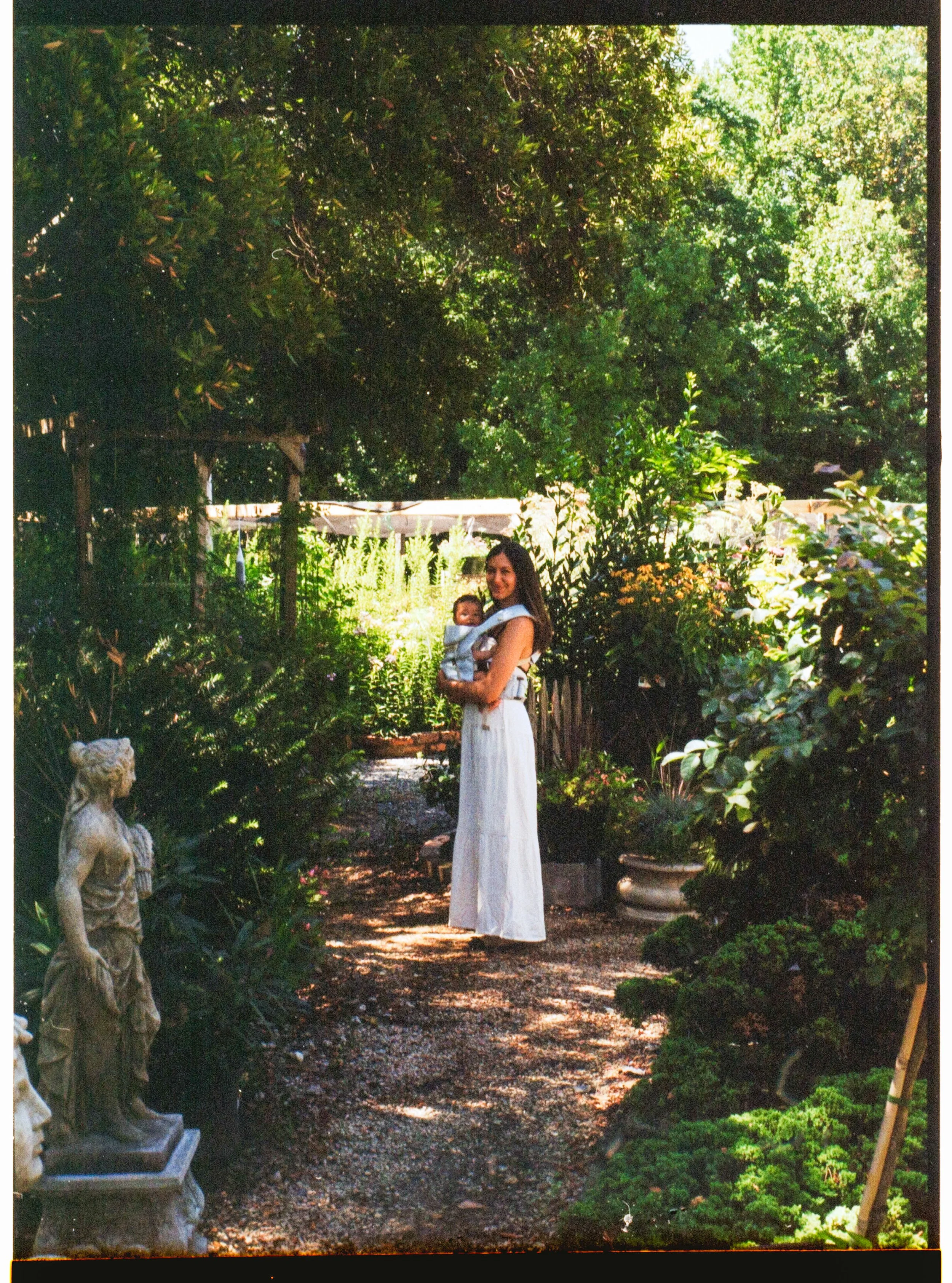 mother and daughter strolling around garden in huntersville north carolina on film
