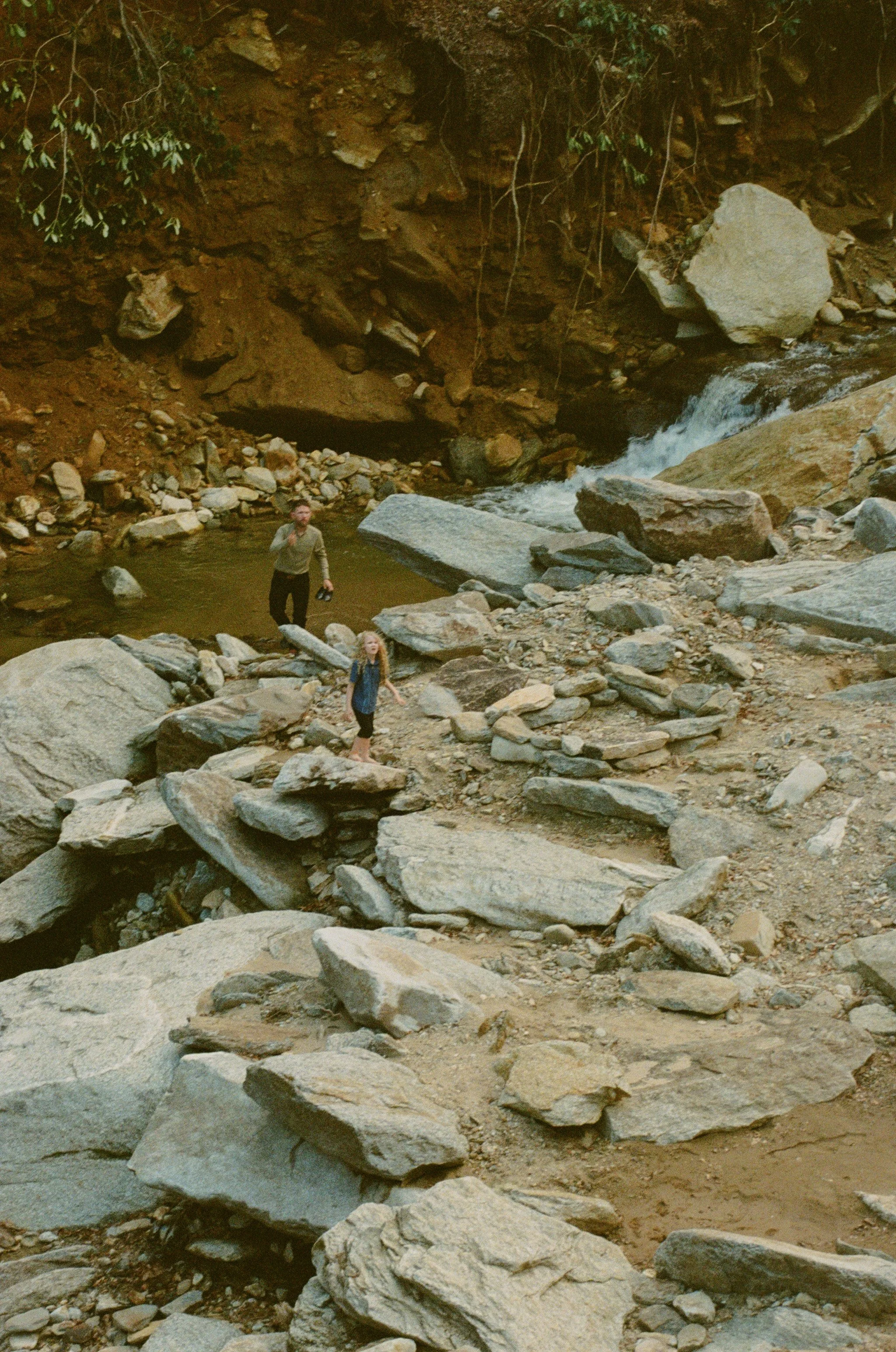 boys exploring the river and rocks in western north carolina