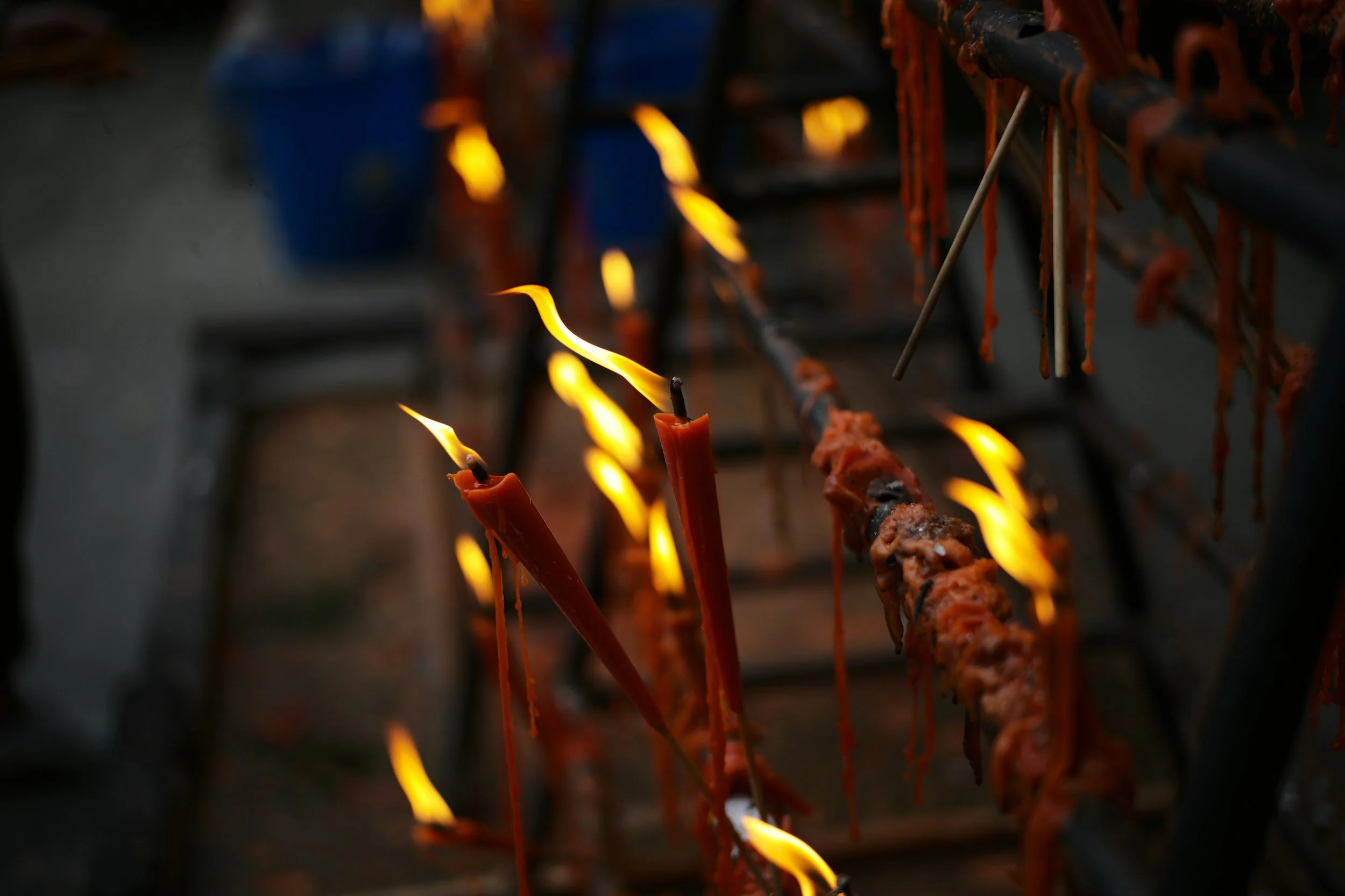 red candles burning, in ancestral healing ritual