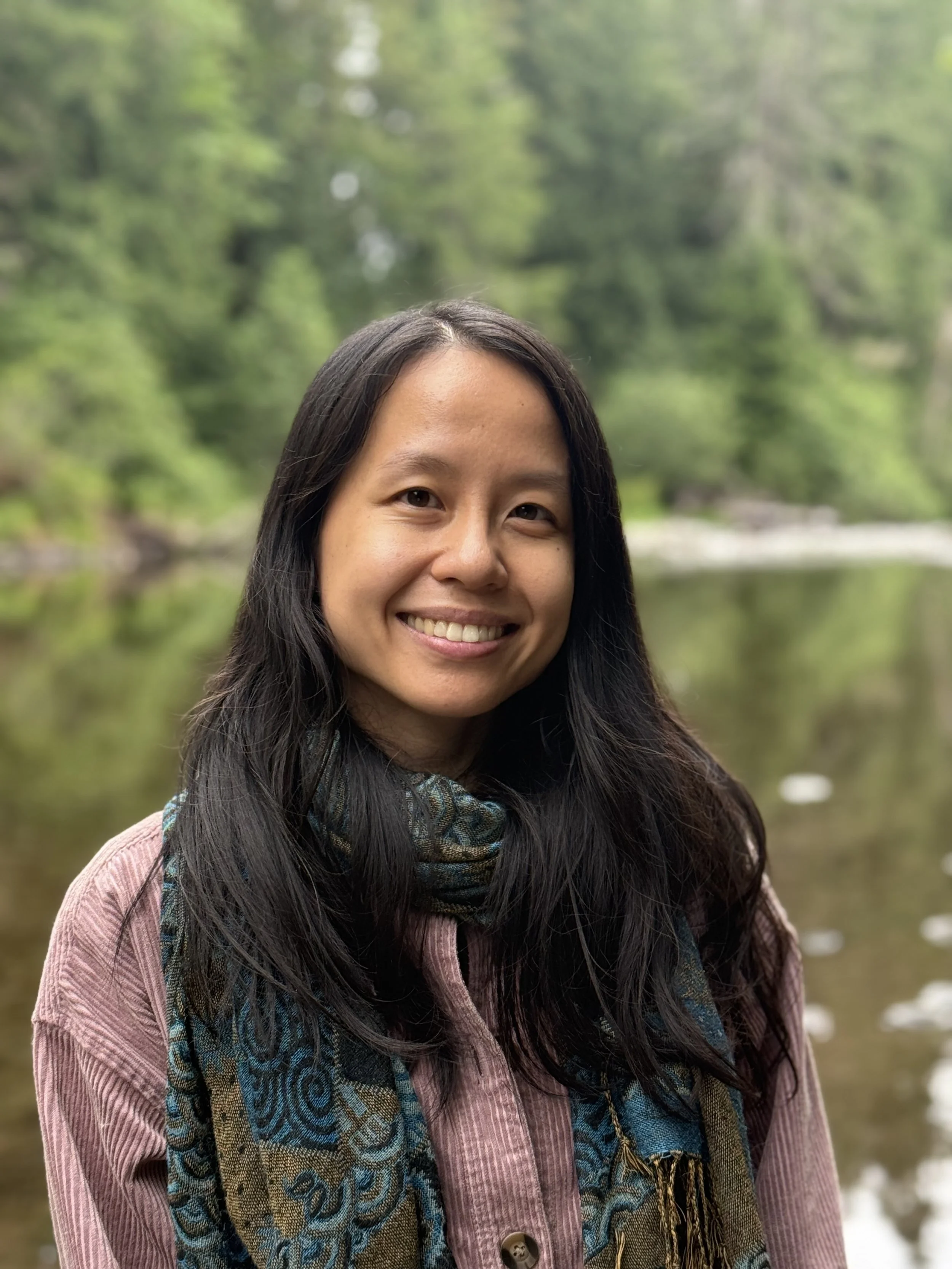 liz zhou, neurodivergent POC therapist, smiling in nature