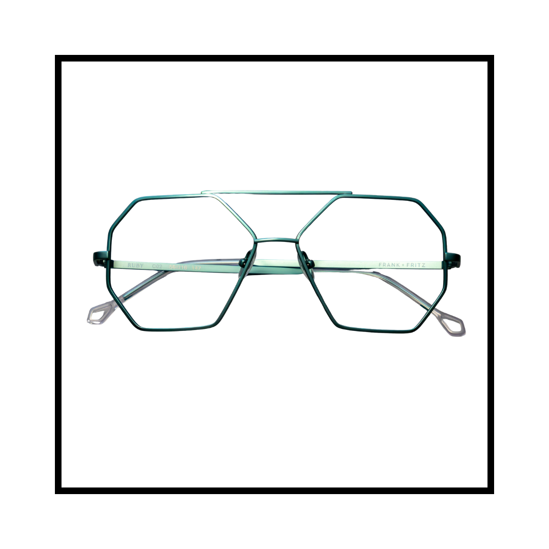 A pair of unique, geometric-shaped eyeglasses with metal frames and clear lenses, positioned against a white background within a black-bordered frame.