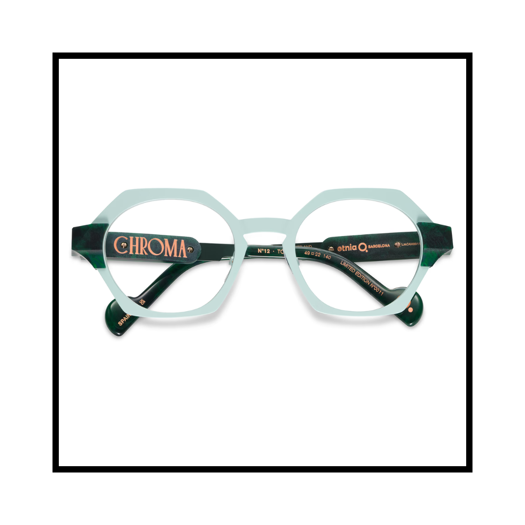 Stylish eyeglasses with transparent and dark green frames, featuring the word 'CHROMA' on the temples.