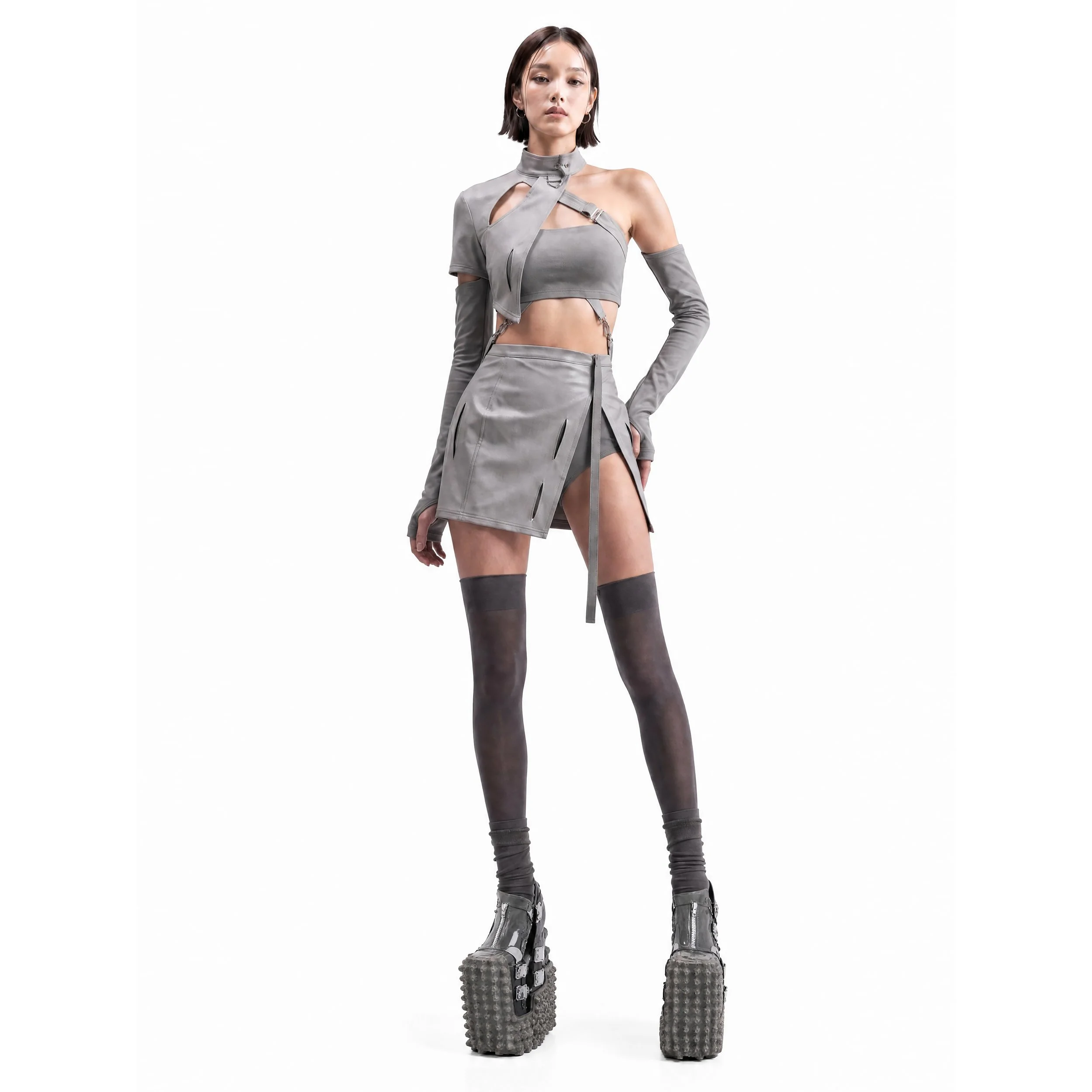 Model Jun Xeda outfitted in a pair of avant-garde heels inspired by extraterrestrial geological terrains. It features an unconventional design that comprises of a unique way of wearing the heels. The design is accentuated by an exaggerated heels that