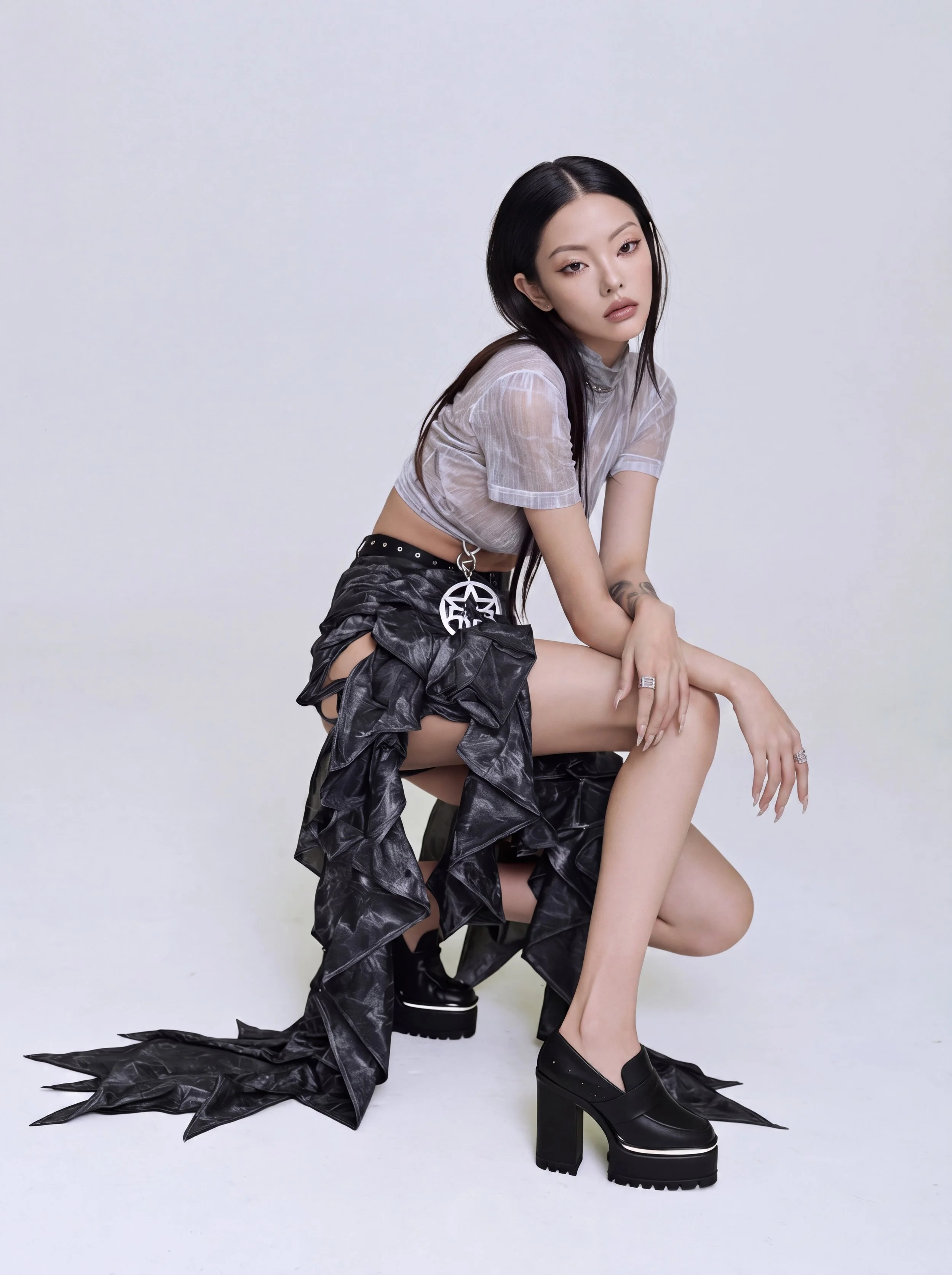 Model Xia Iseri in an avant-garde neo-gothic outfit, fusing streetwear punk aesthetics with high fashion. She is posing in a dynamic manner, with her white sheer crop top, deconstructed ruffled maxi skirt and platform loafers.