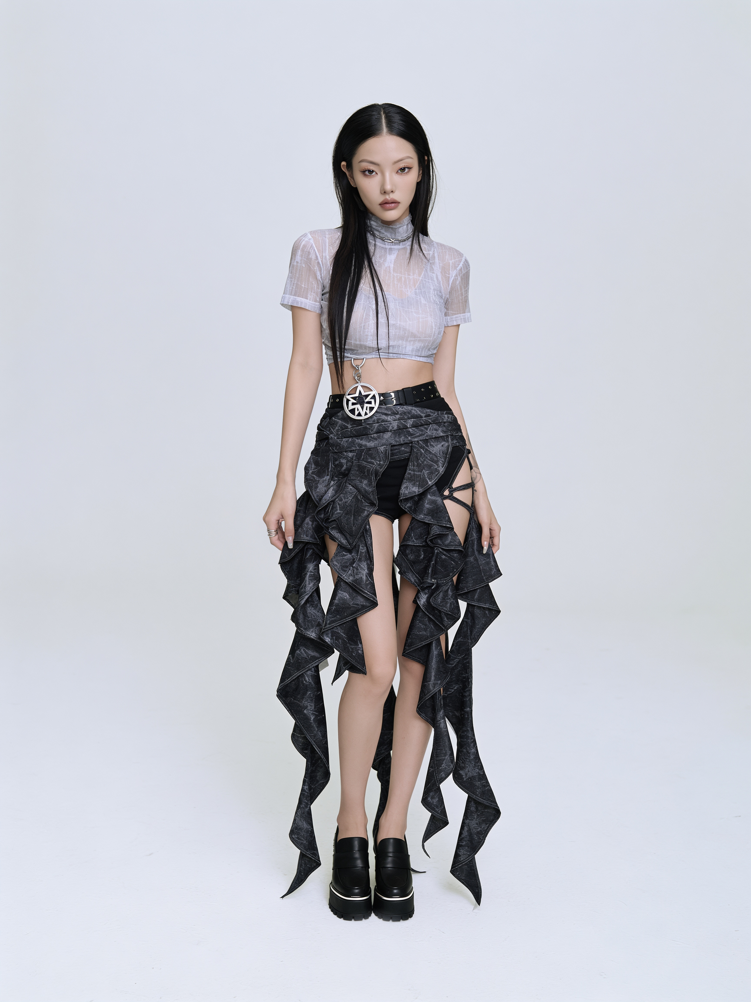 Model Xia Iseri in an avant-garde neo-gothic outfit, fusing streetwear punk aesthetics with high fashion. She is posing in a dynamic manner, with her white sheer crop top, deconstructed ruffled maxi skirt and platform loafers. She looks beautiful and