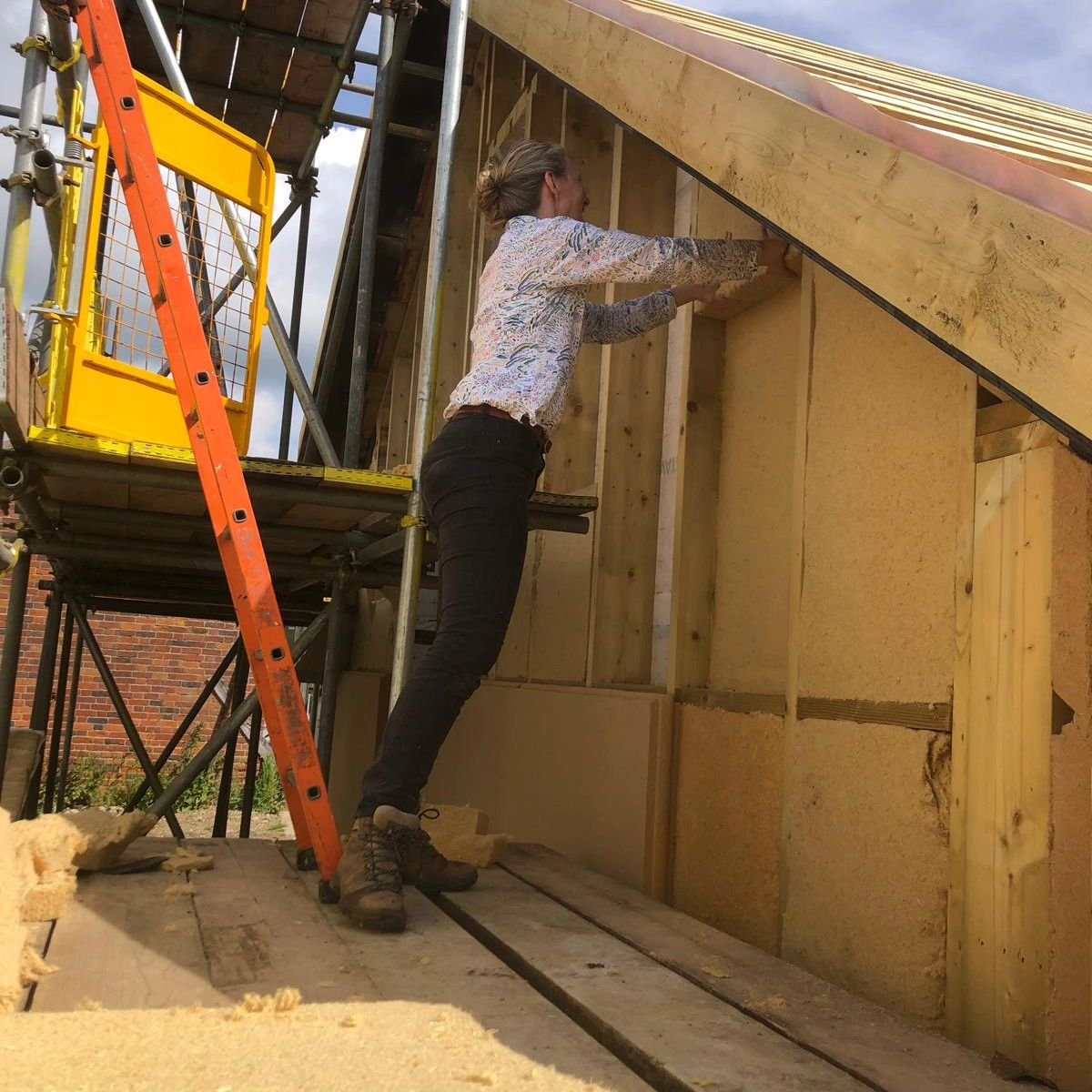 Summer 2024. Installing PAVAFLEX wood fibre insulation to the workshop. Supplied by Unity Lime Products.