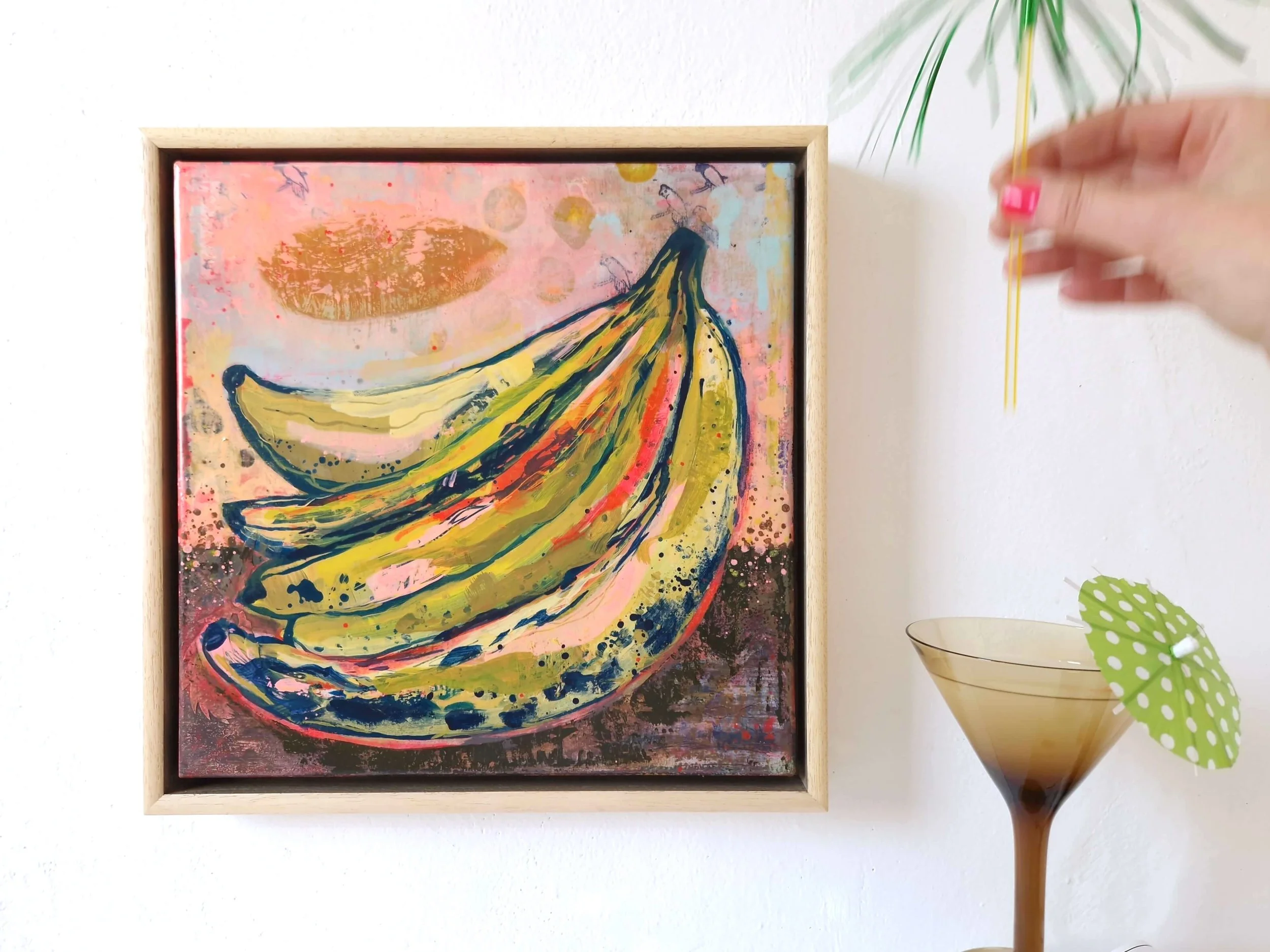 colourful abstract painting of vibrant bananas, framed