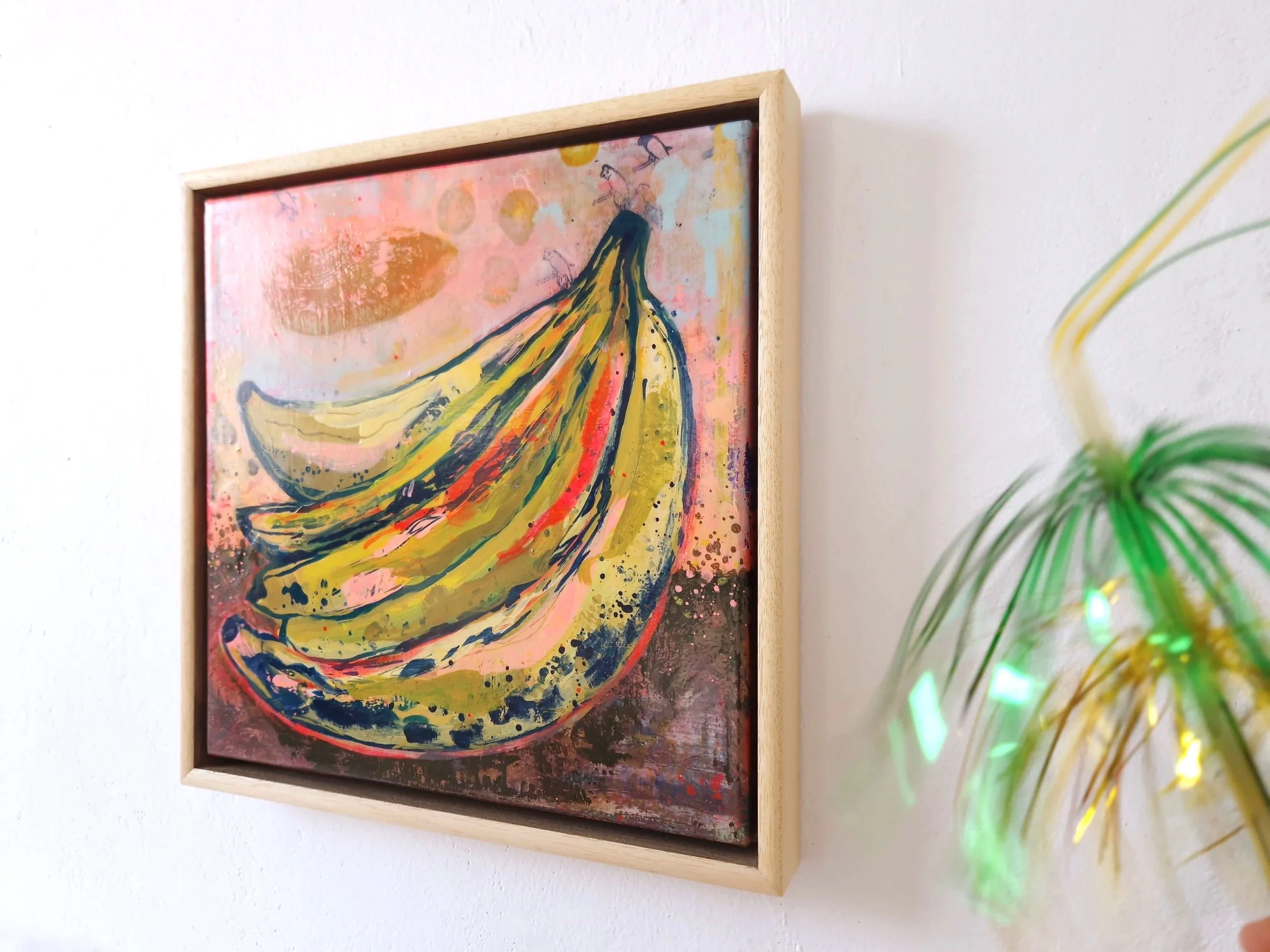 colourful abstract painting of vibrant bananas, angled view