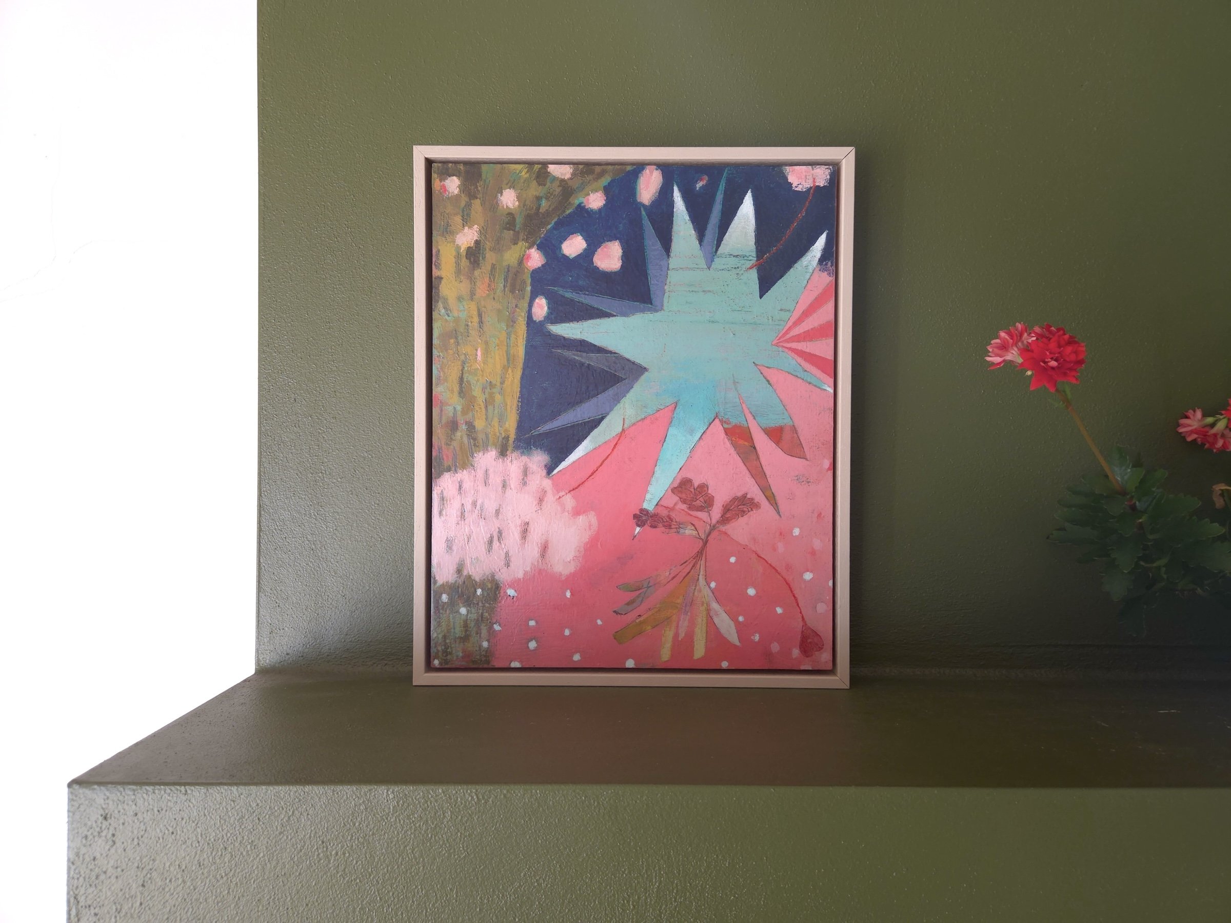 small cheerful abstract painting with playful colour and fantasy, on a green wall