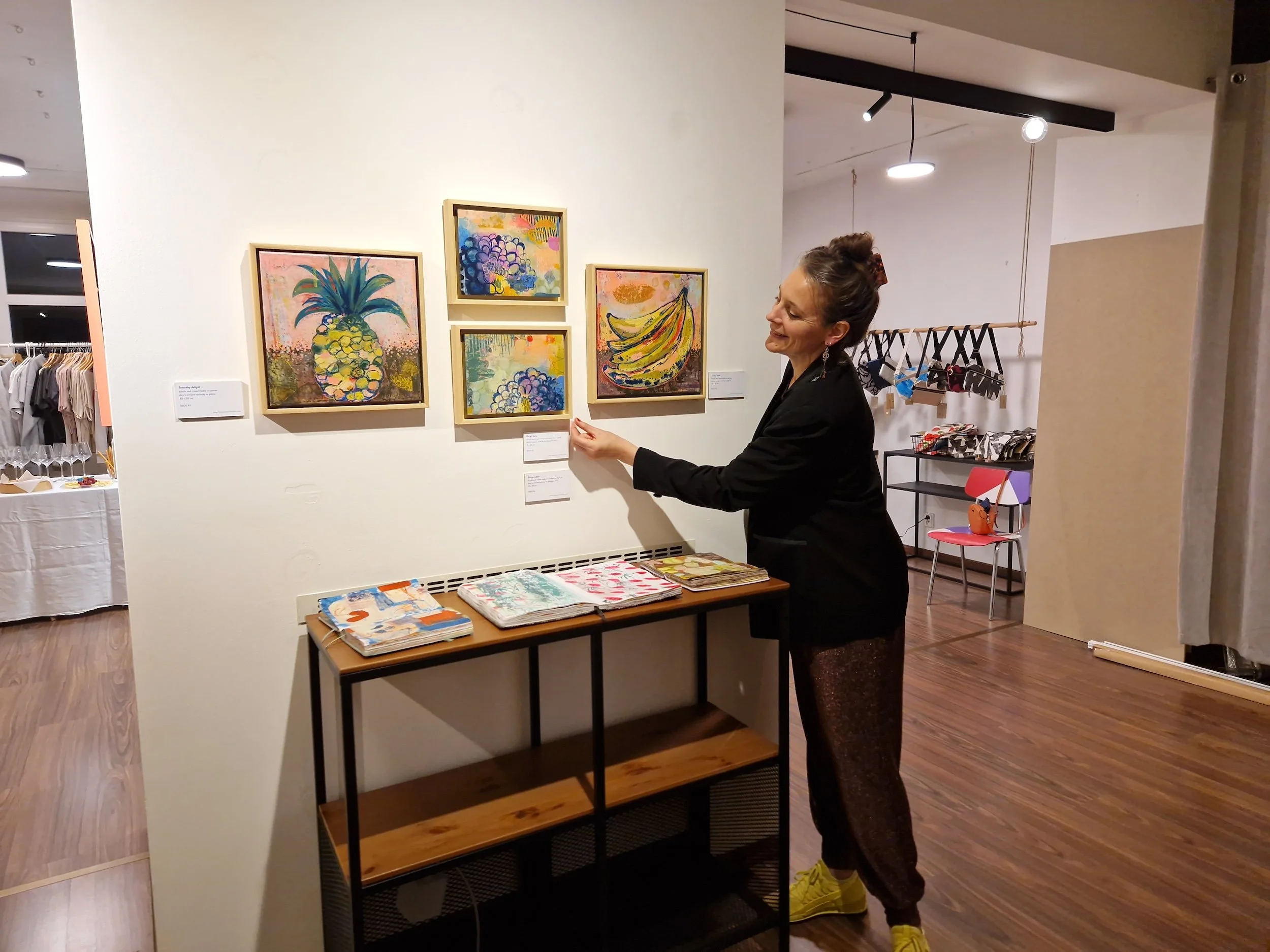 Artist Hélène Maroutian making the final adjustment before the opening of her show