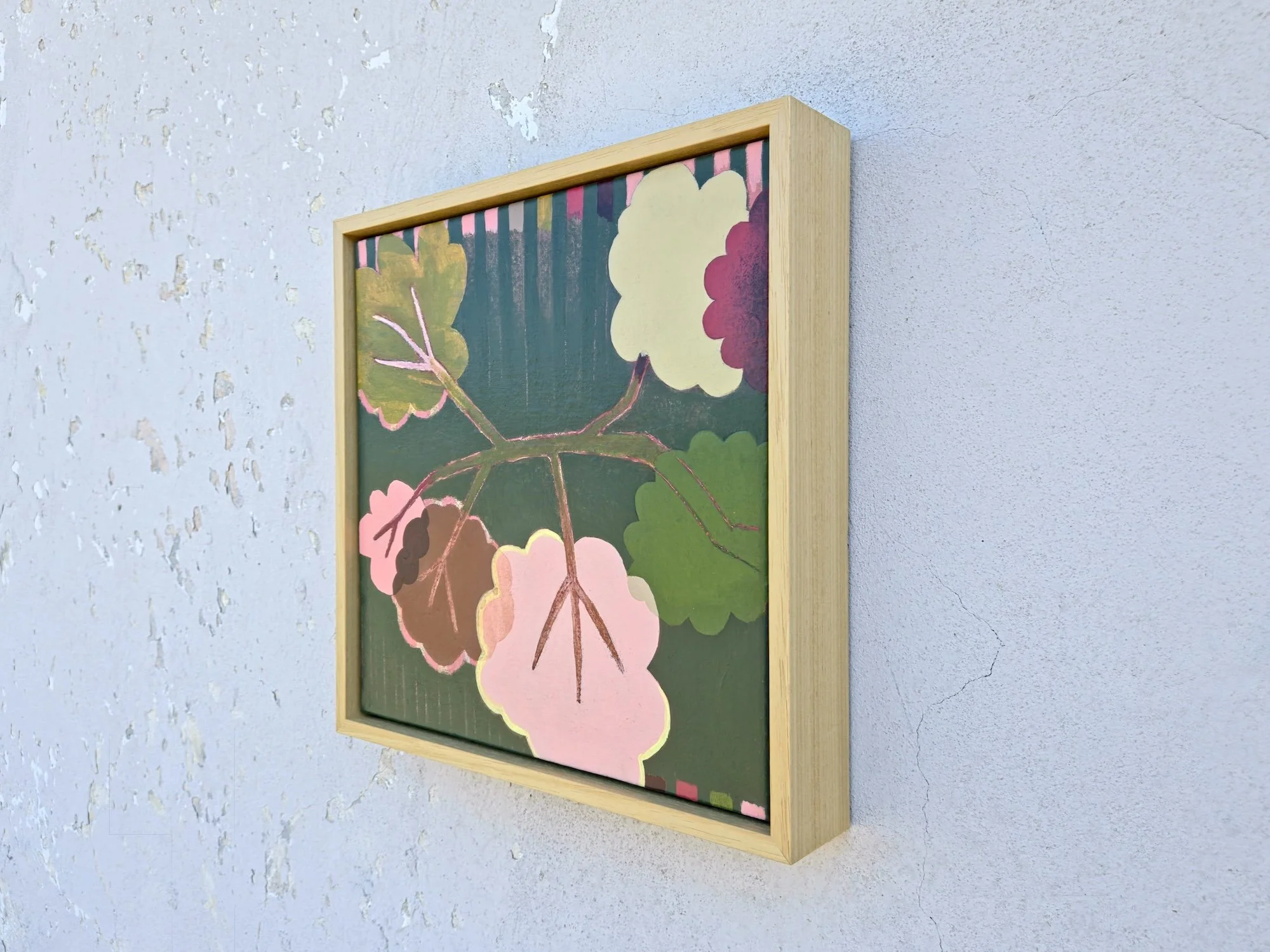 angled view, framed botanical painting in pinks and greens