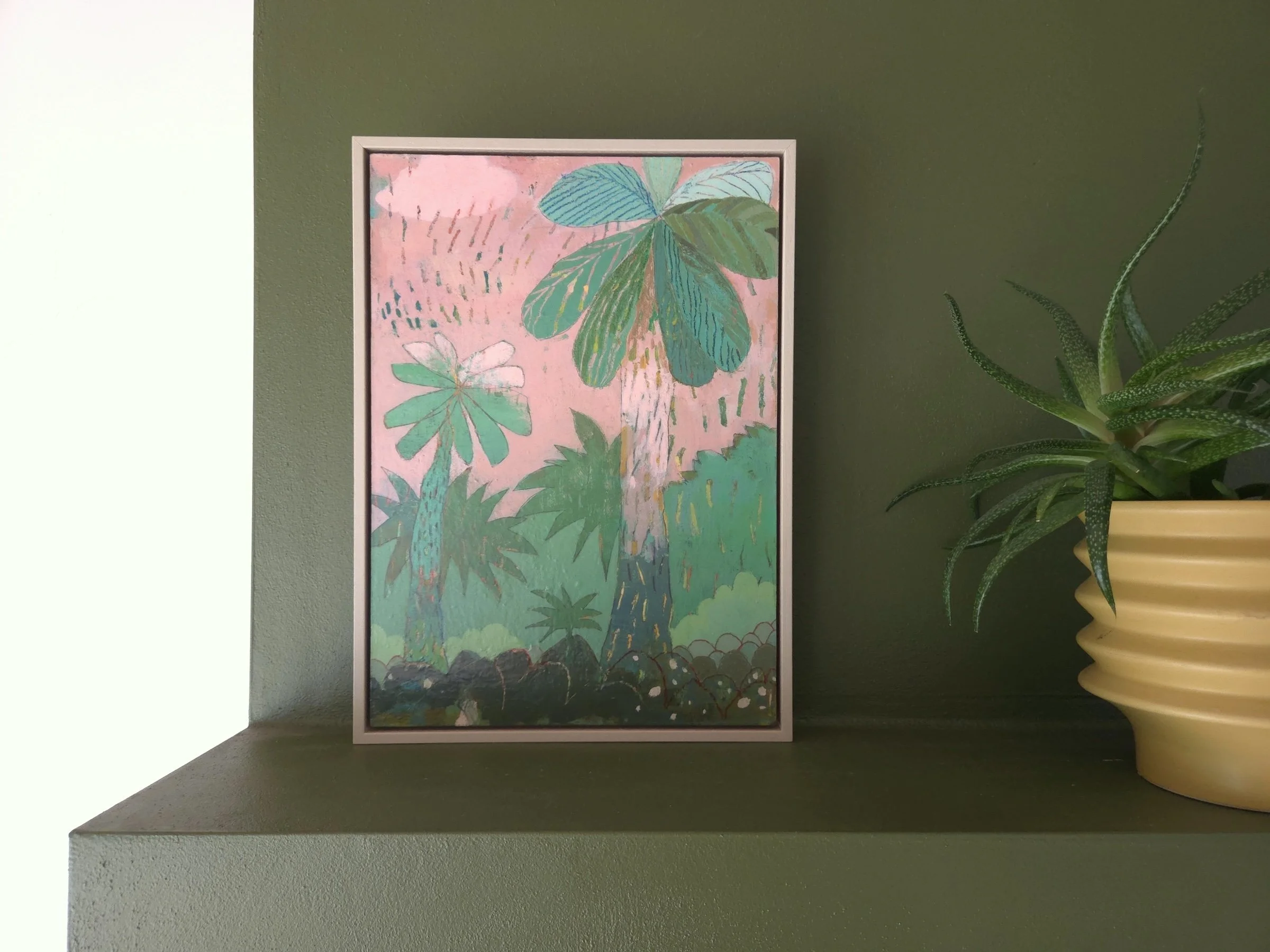 whimsical abstract landscape painting with layered colours and shapes, on a green wall