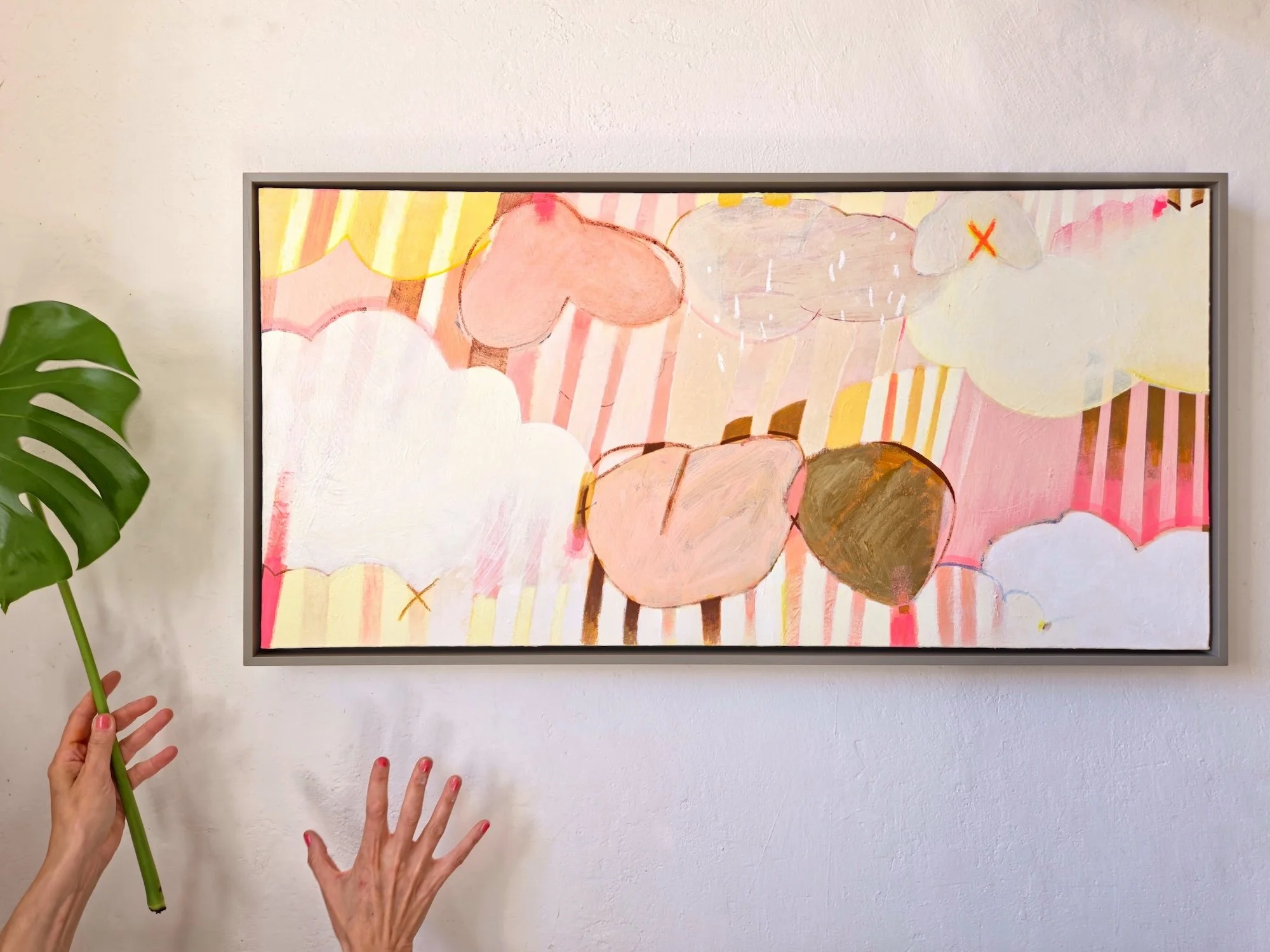 framed botanical painting with colourful striped background