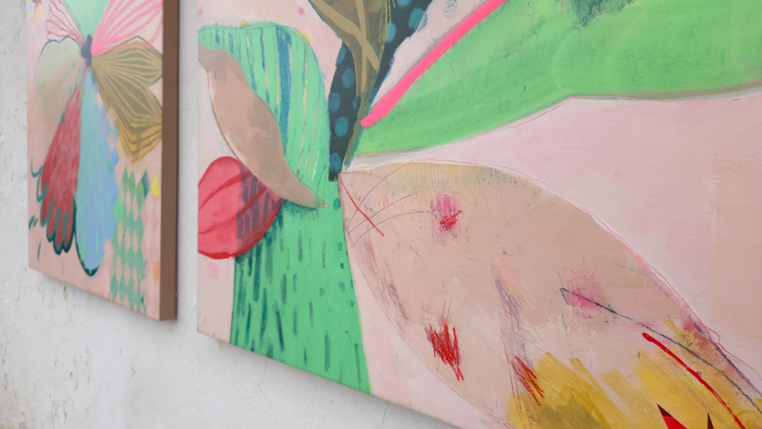 detail on two canvases showing big colourful palm tree paintings