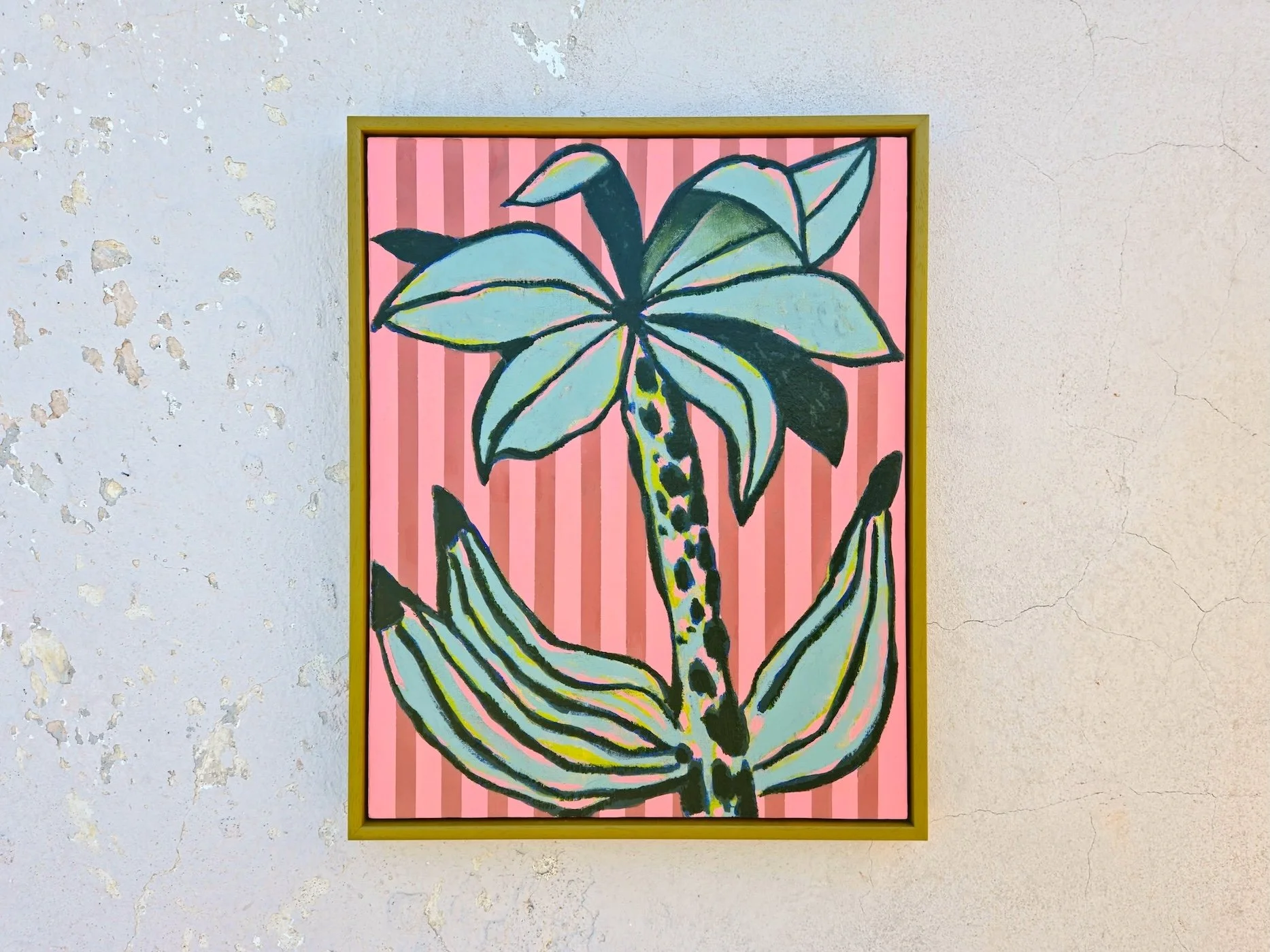 framed palm tree painting with pink striped background