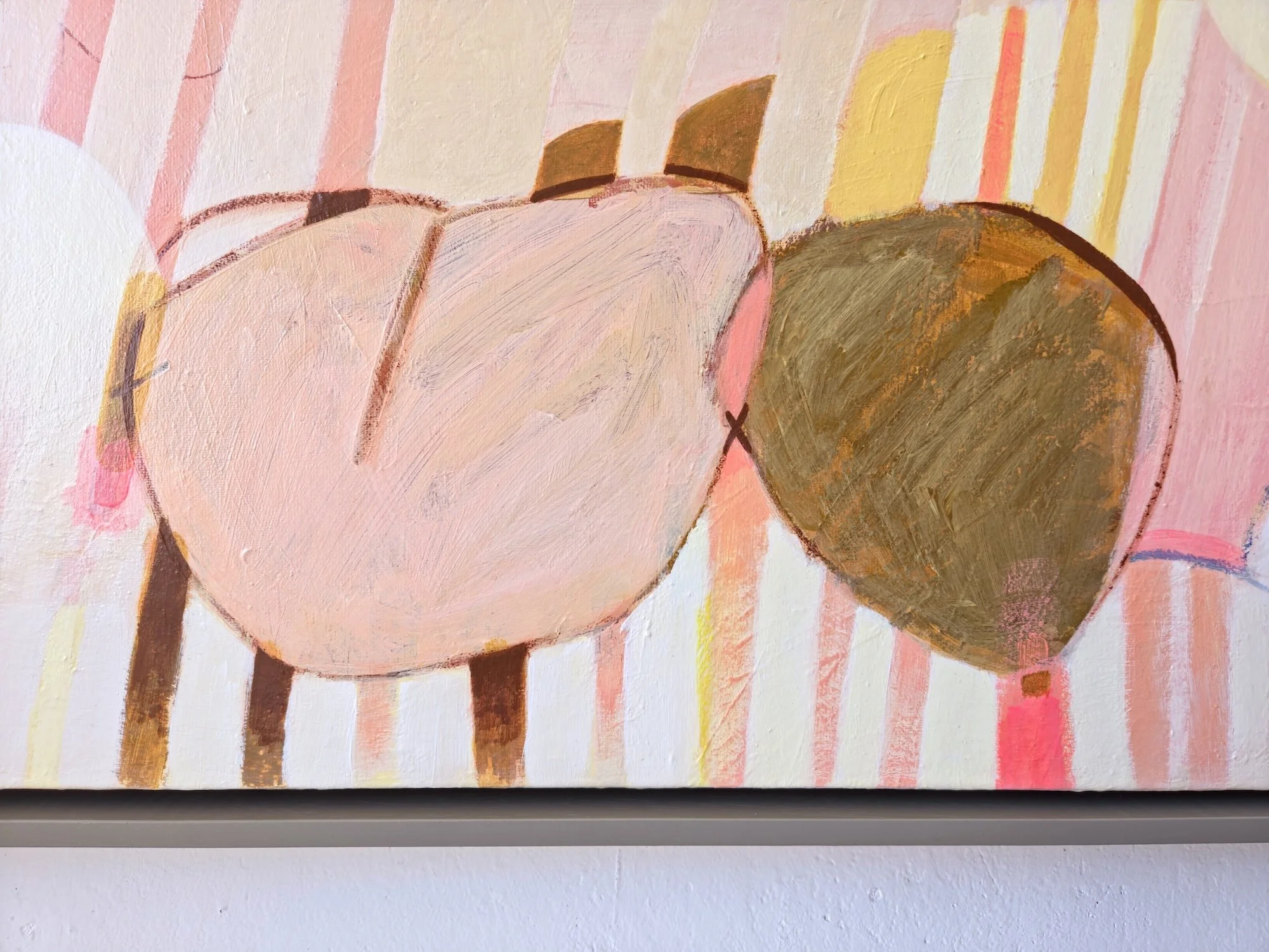 detail of framed botanical painting with colourful striped background