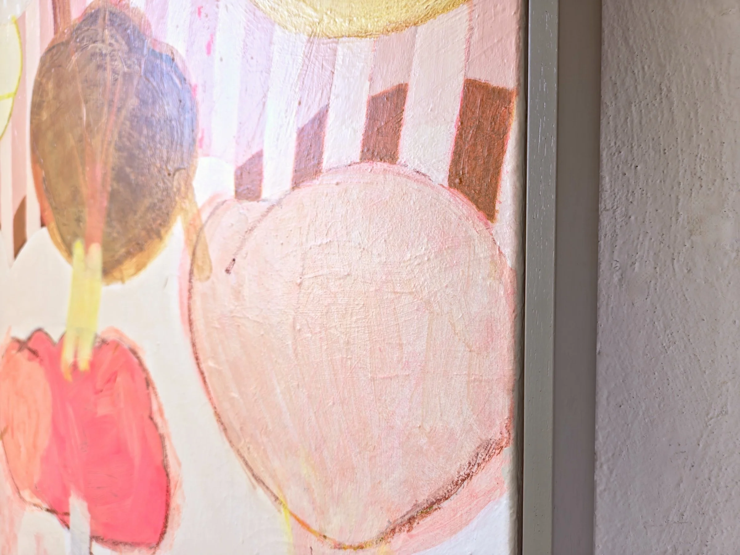 detail of framed botanical painting in pinks and browns with bold stripes