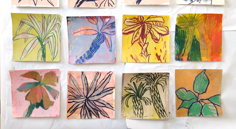 grid of colourful studies of palm trees on square pieces of paper used to develop ideas before starting a palm tree painting series.