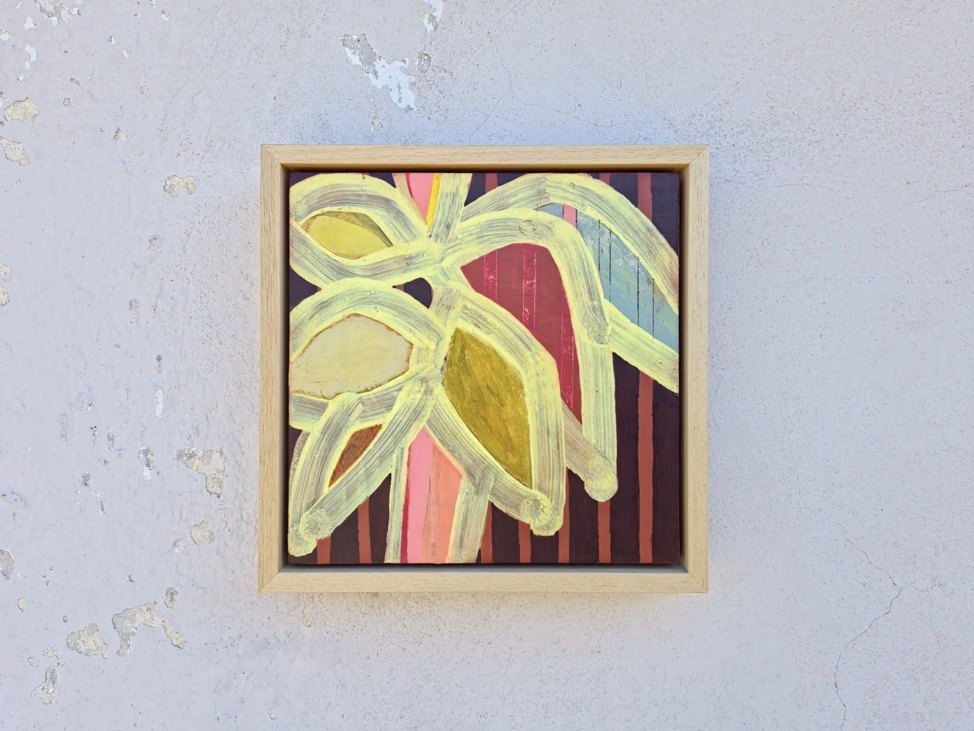 framed botanical painting in vibrant colours with a striped background