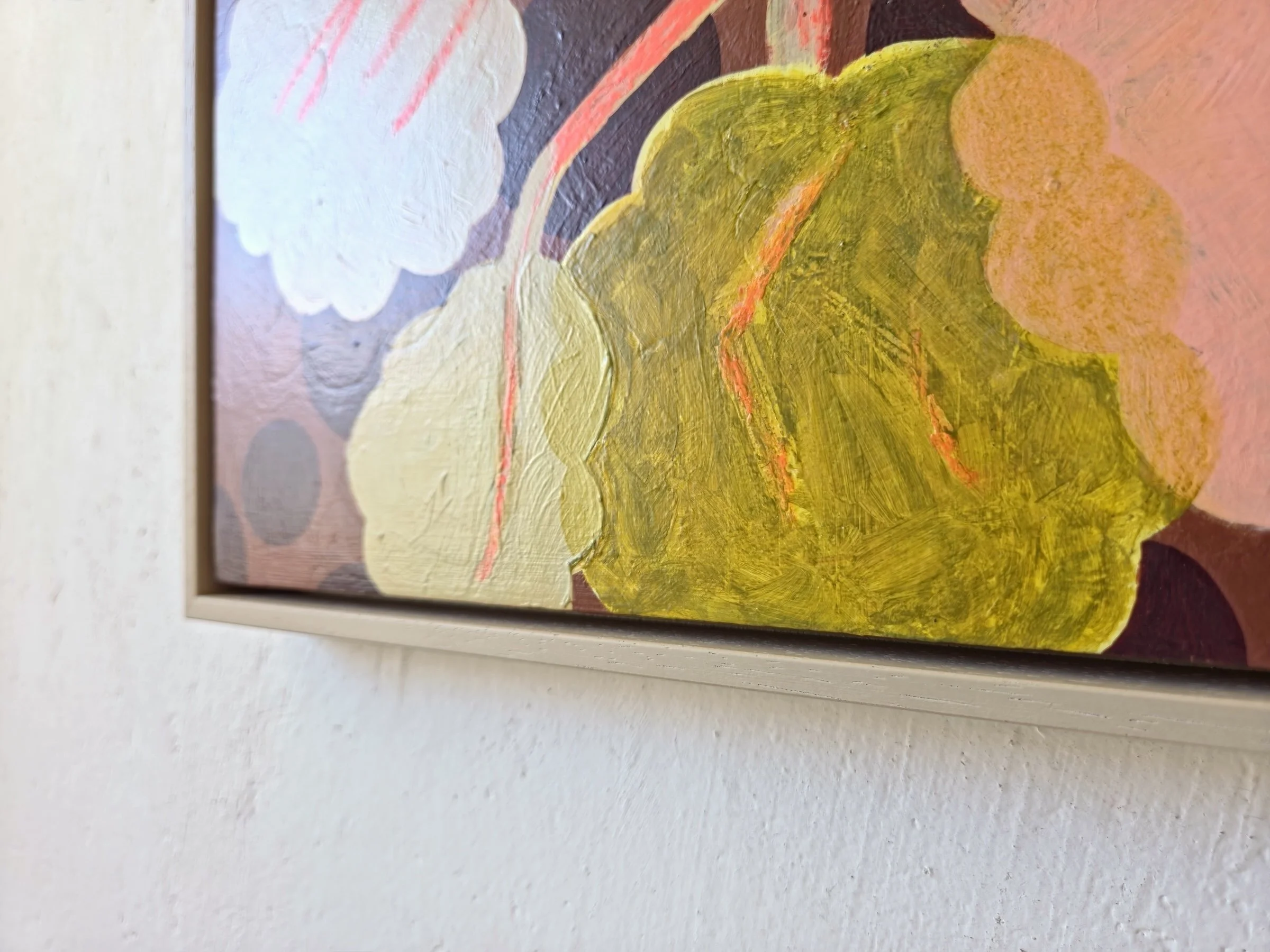 detail of framed botanical painting in pinks, beige and browns
