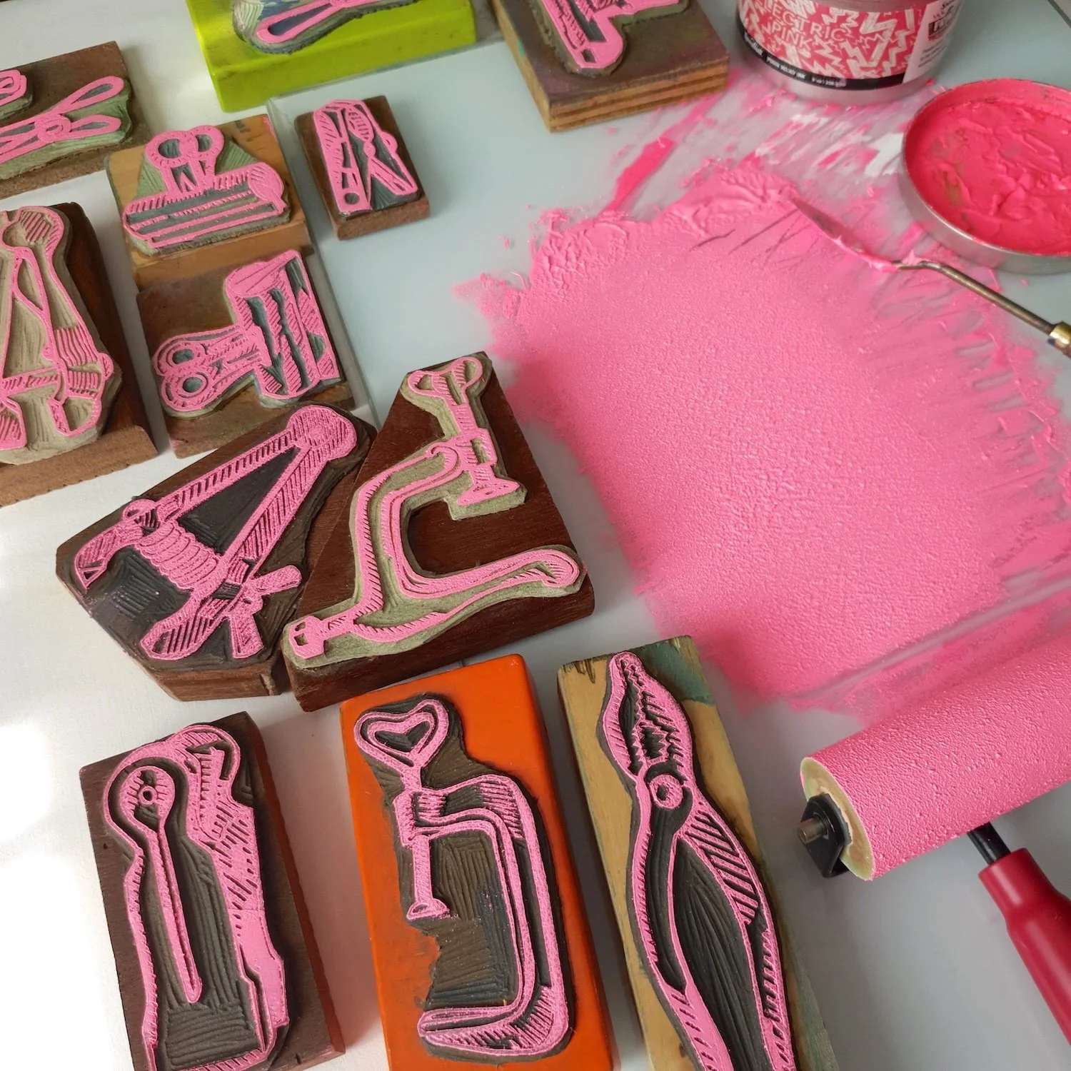 linocut blocks and ink representing tools