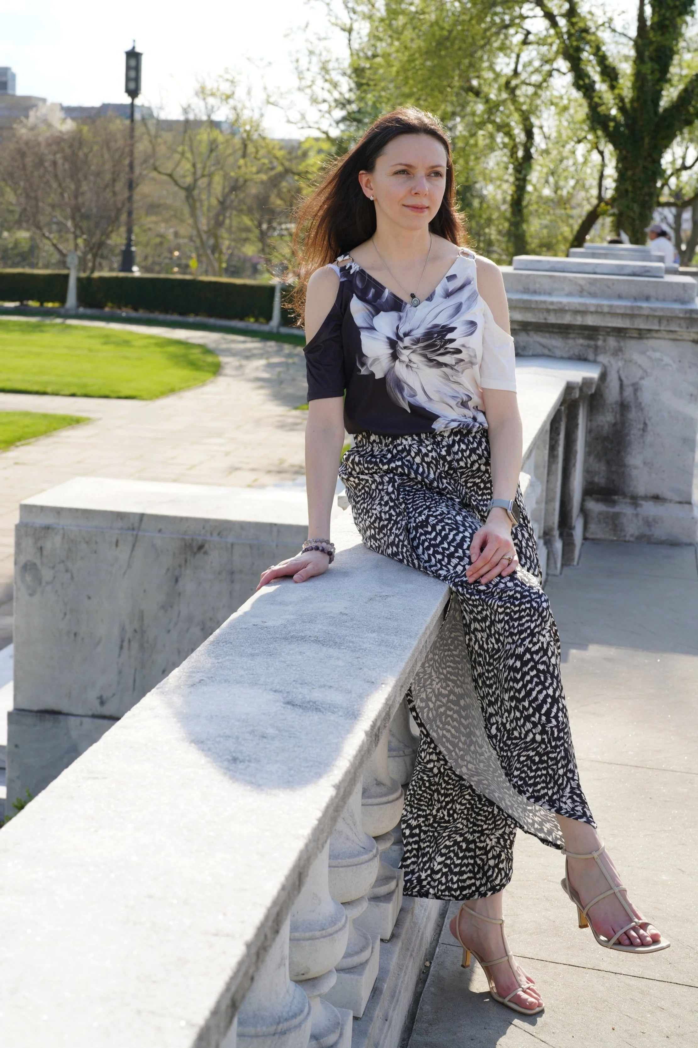 Portrait of Elena Olenyk outdoors in a peaceful park setting.