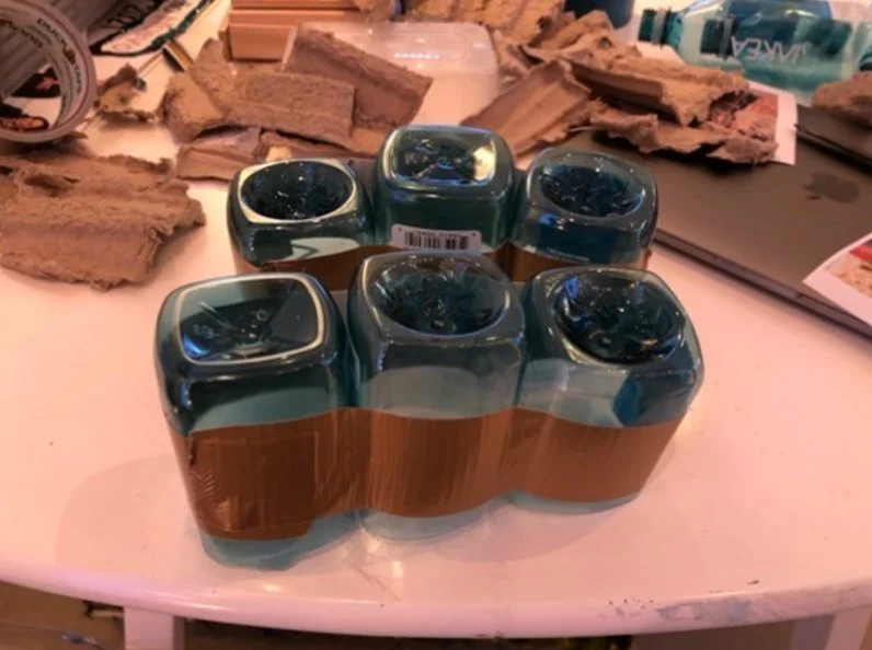 The Canyon takes shape with reused water bottles, old packaging, and duct tape, of course