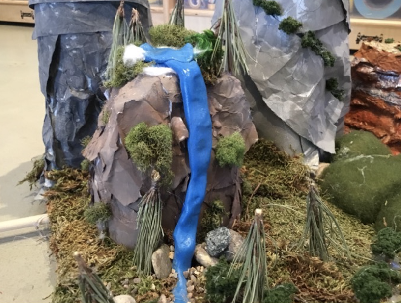 Mountain runoff transforms into a waterfall