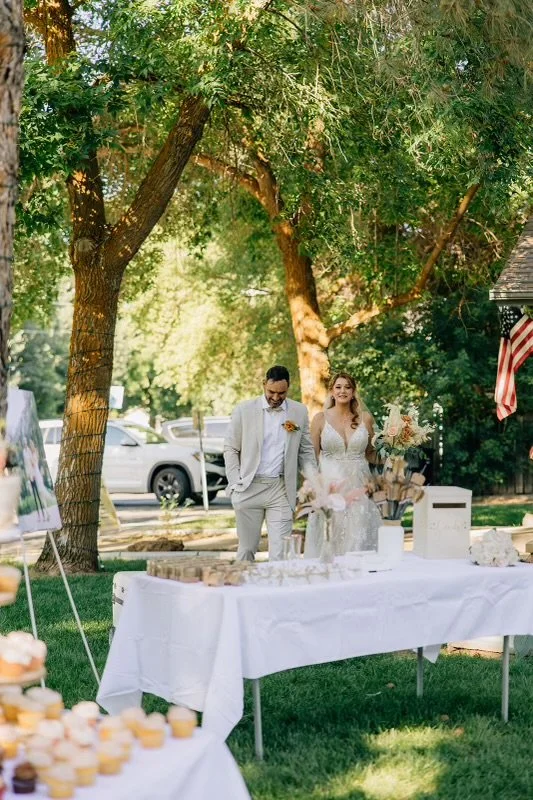 Outdoor tables set beneath mature trees at Old Town Hall in Huntsville, Utah.