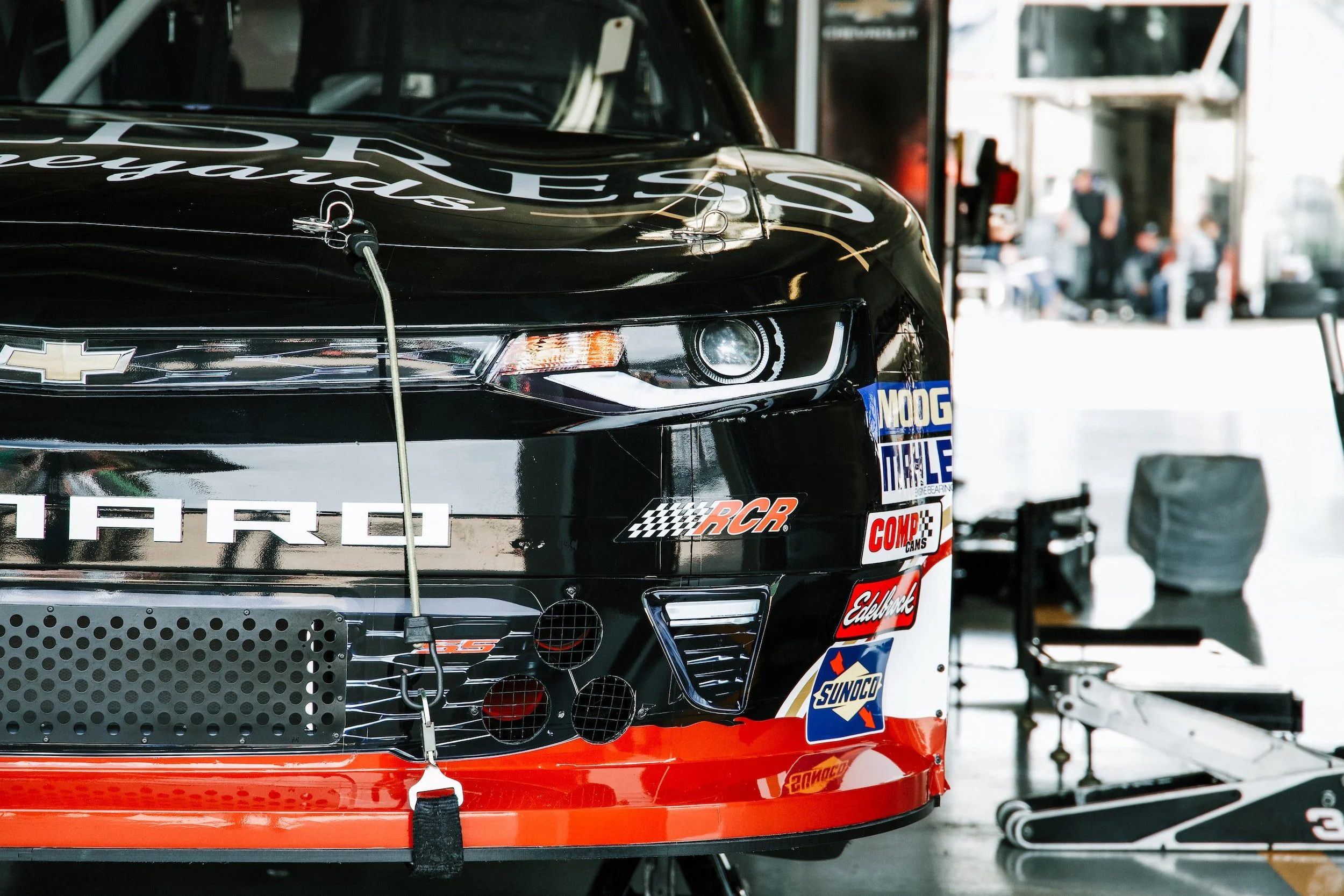 A picture of a NASCAR cup car in the garage