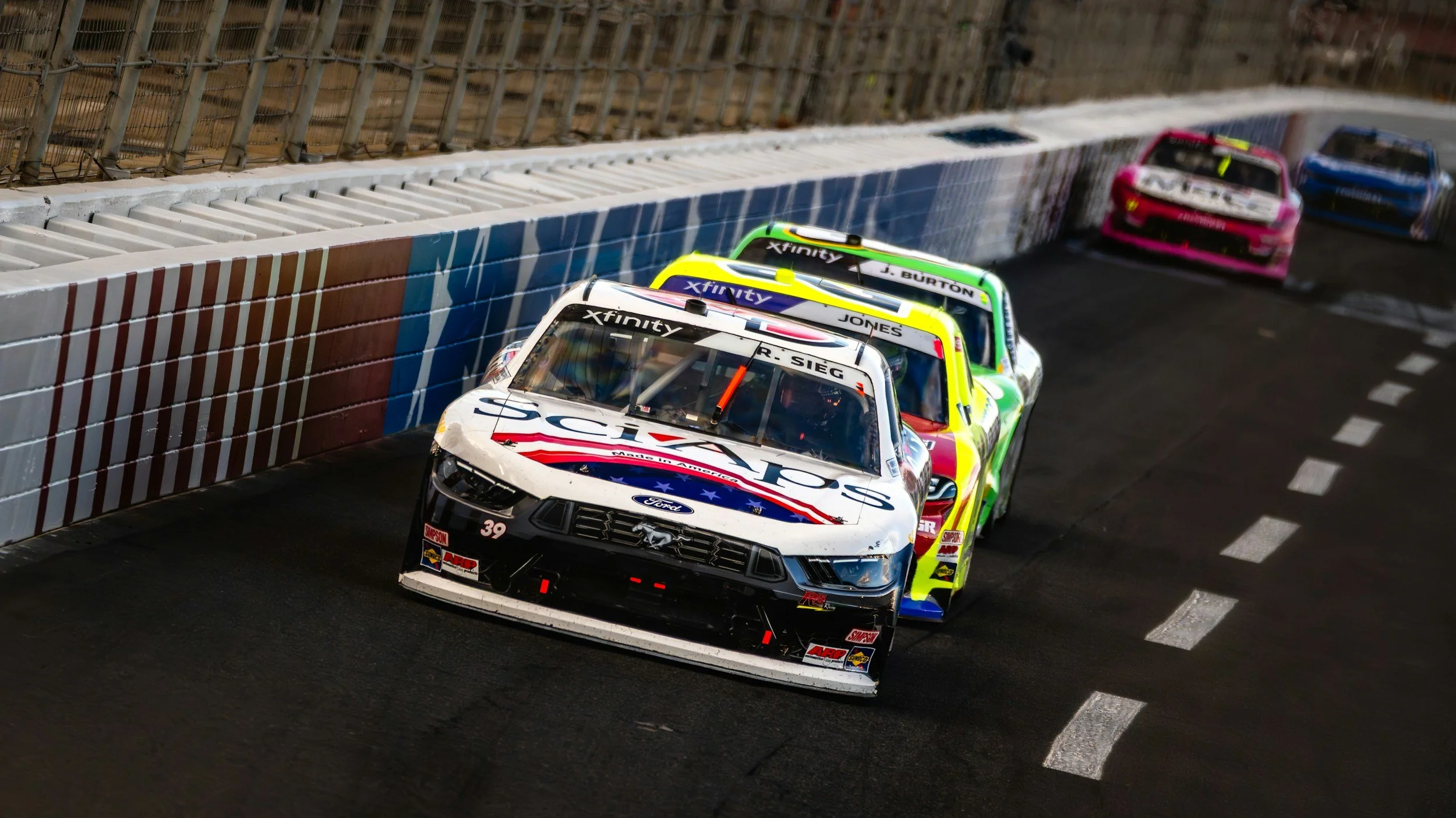 An image of professional motorsport athletes competing and beating their mental blocks