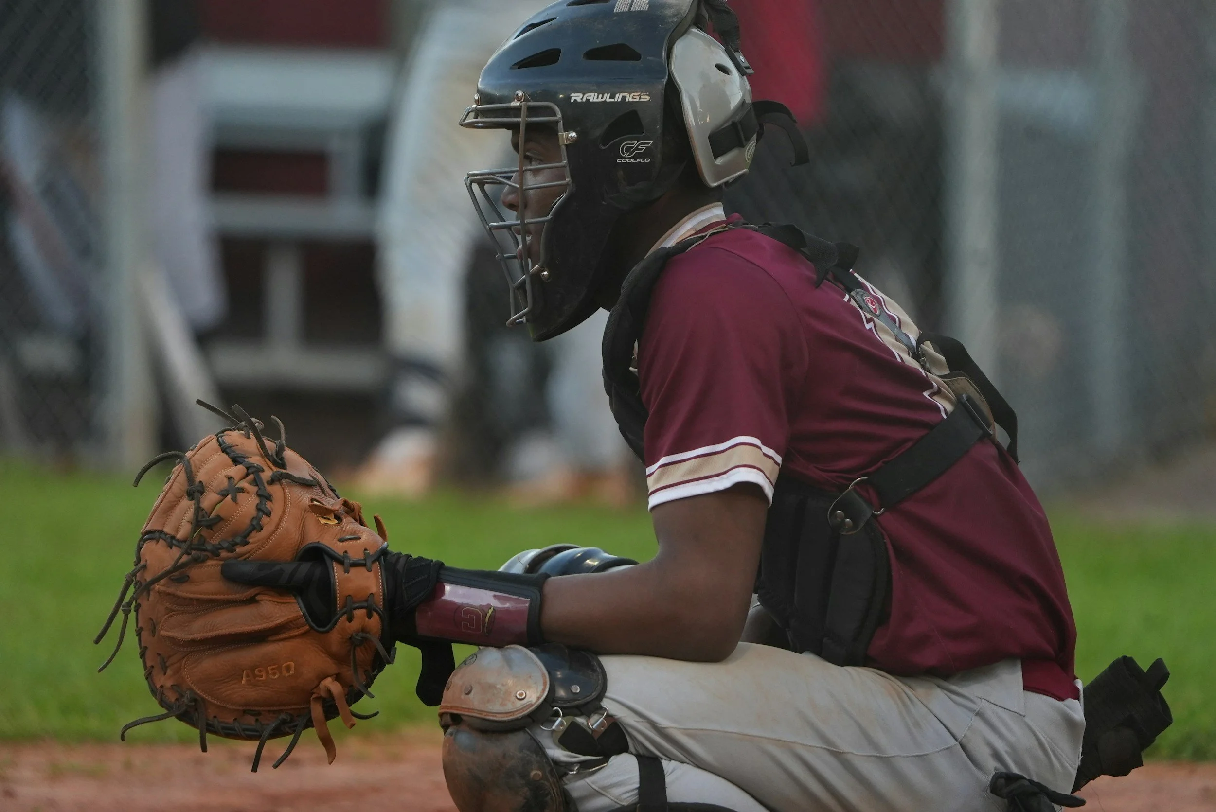 An image of a baseball catcher using mental training to overcome the yips