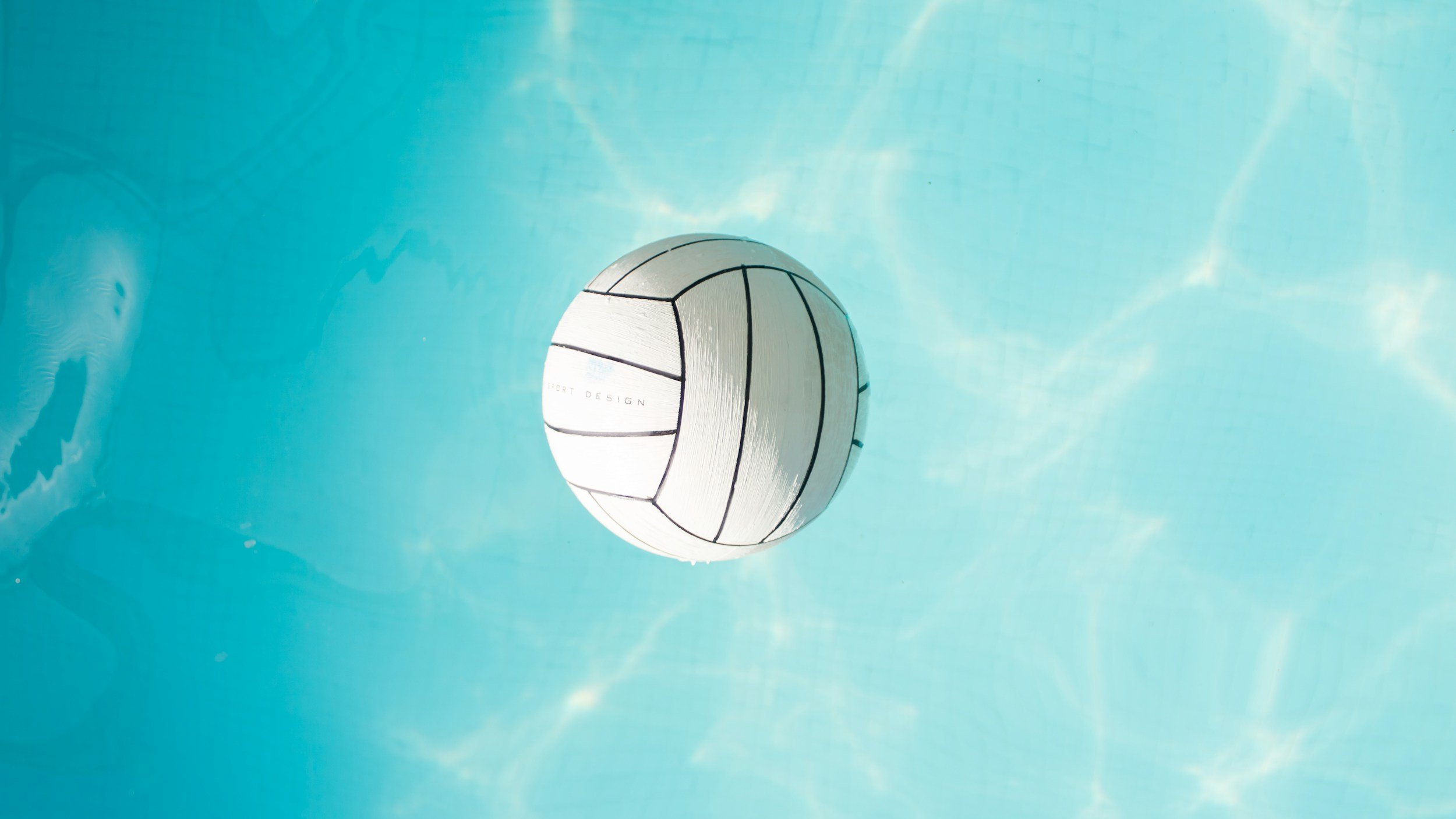 A volleyball in the air after a serve