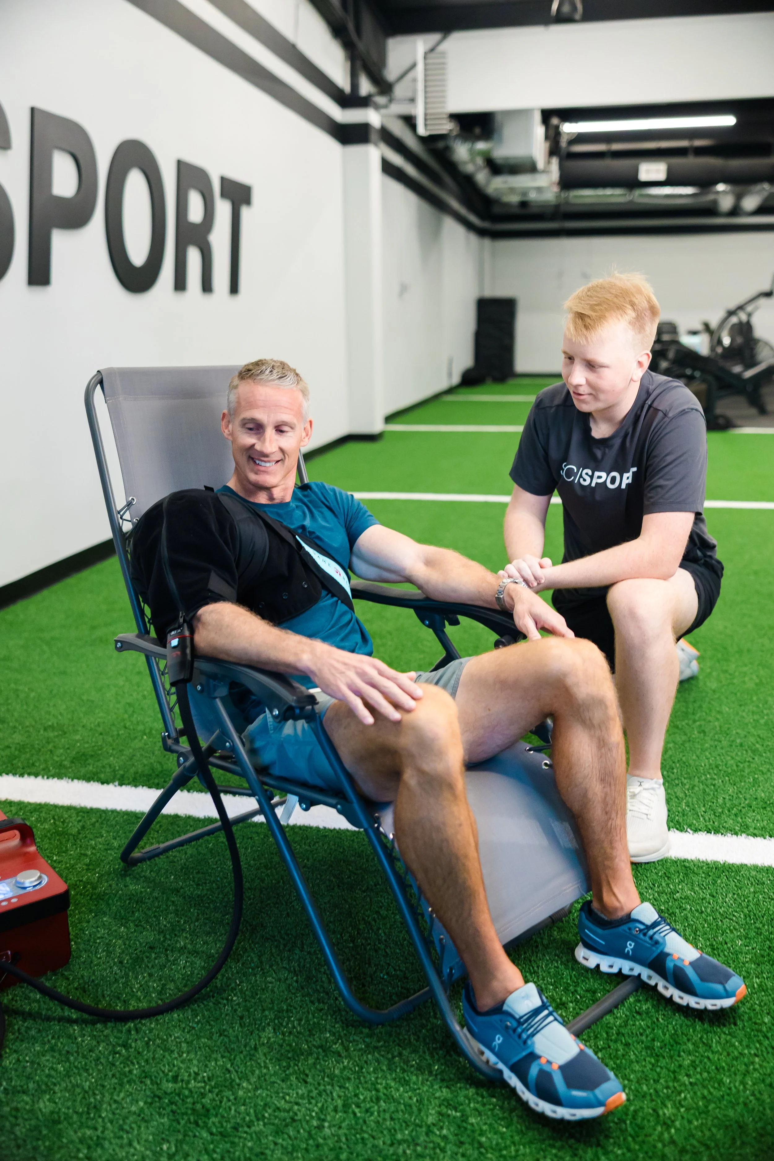 Athlete receiving GameReady cold and compression therapy for injury recovery at sports performance and physical therapy clinic in Wilmington, NC
