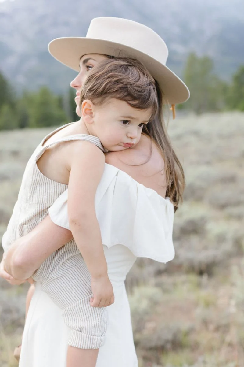 mother holding her little boy during their family photos in Jackson Hole