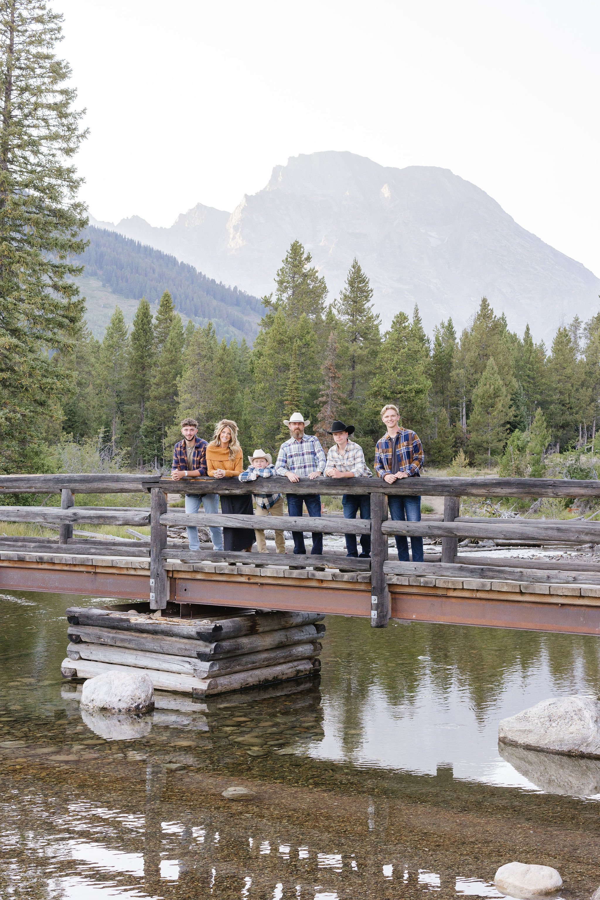 Family poses for photos together, one of the best things to do in Jackson Hole in the fall.