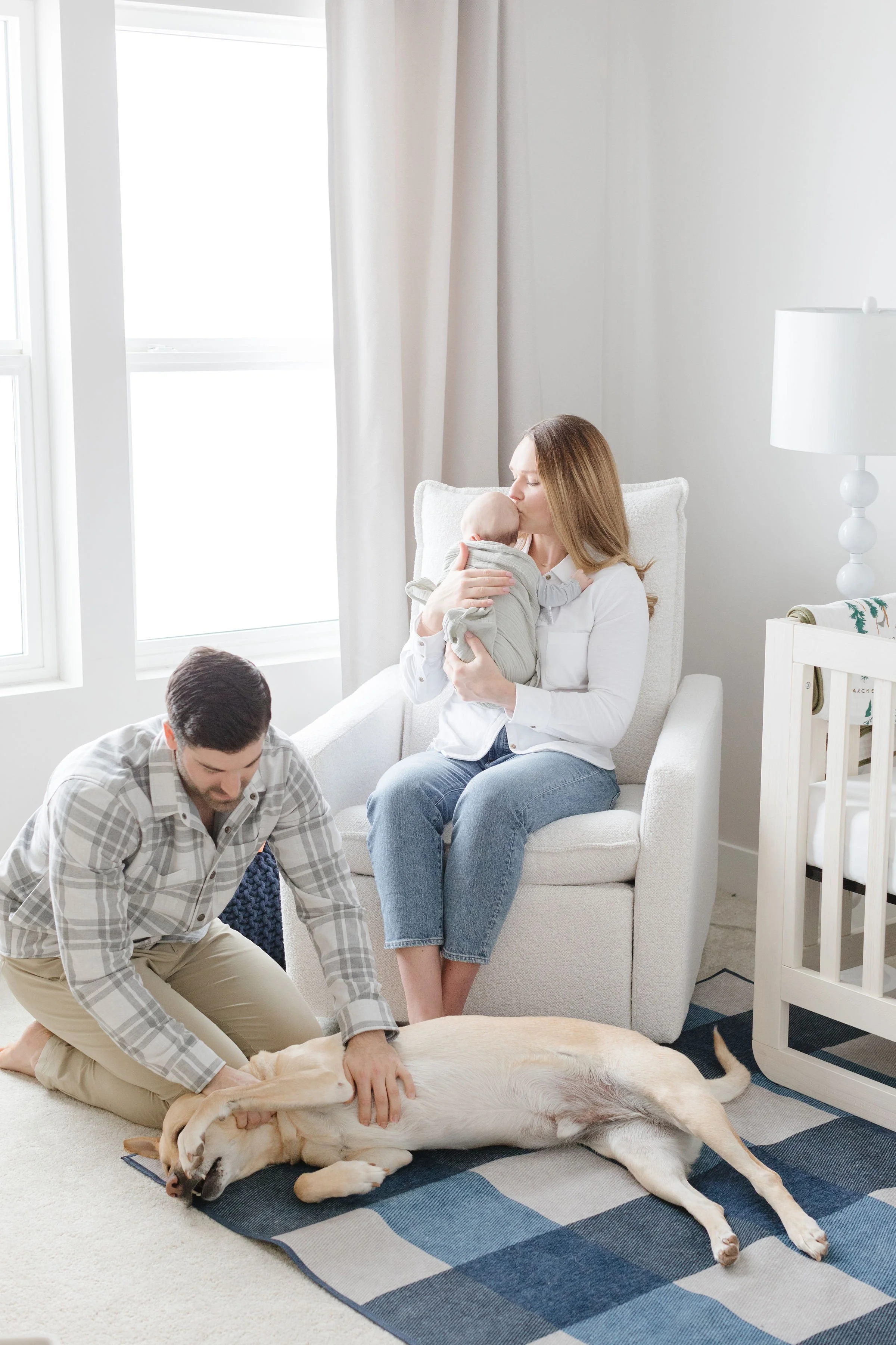  Family spends time in nursery as newborn photographer in Jackson Hole captures their in-home session. 