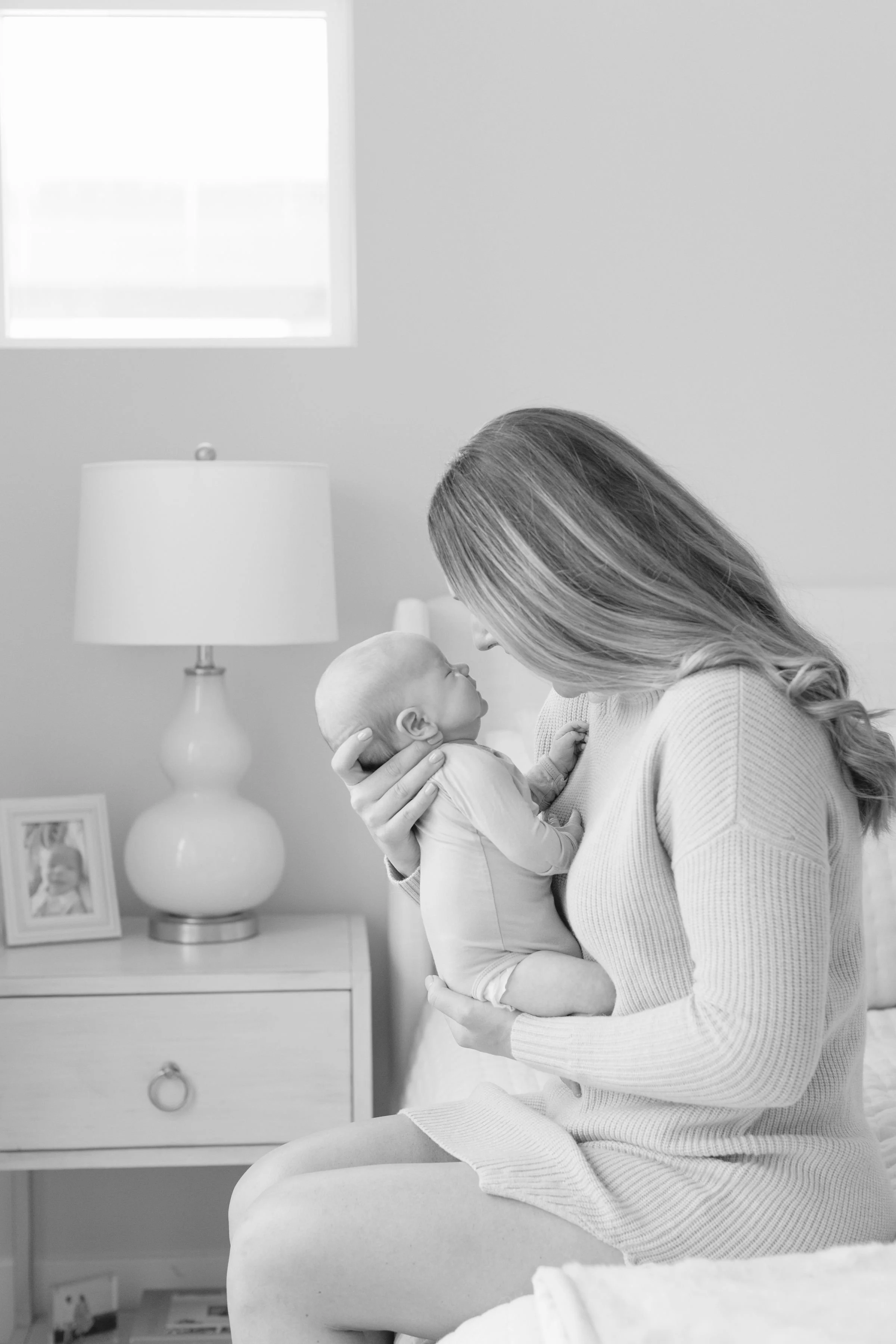  Mom holds baby up to her face 