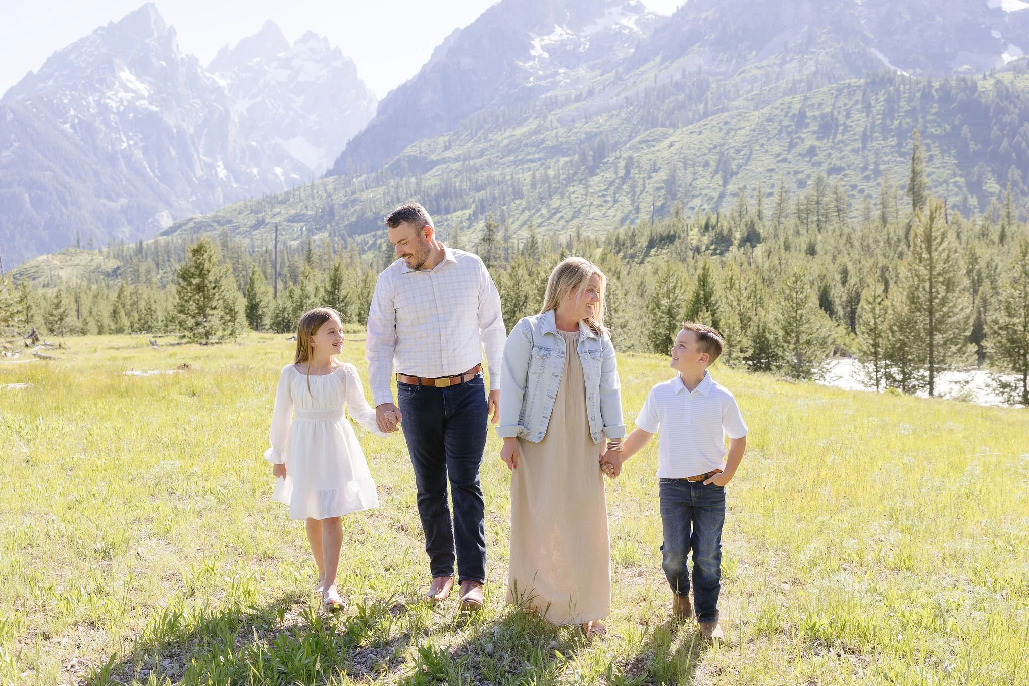  Family takes portraits with local photographer during their stay at the Four Seasons Resort Jackson Hole Teton Village. 