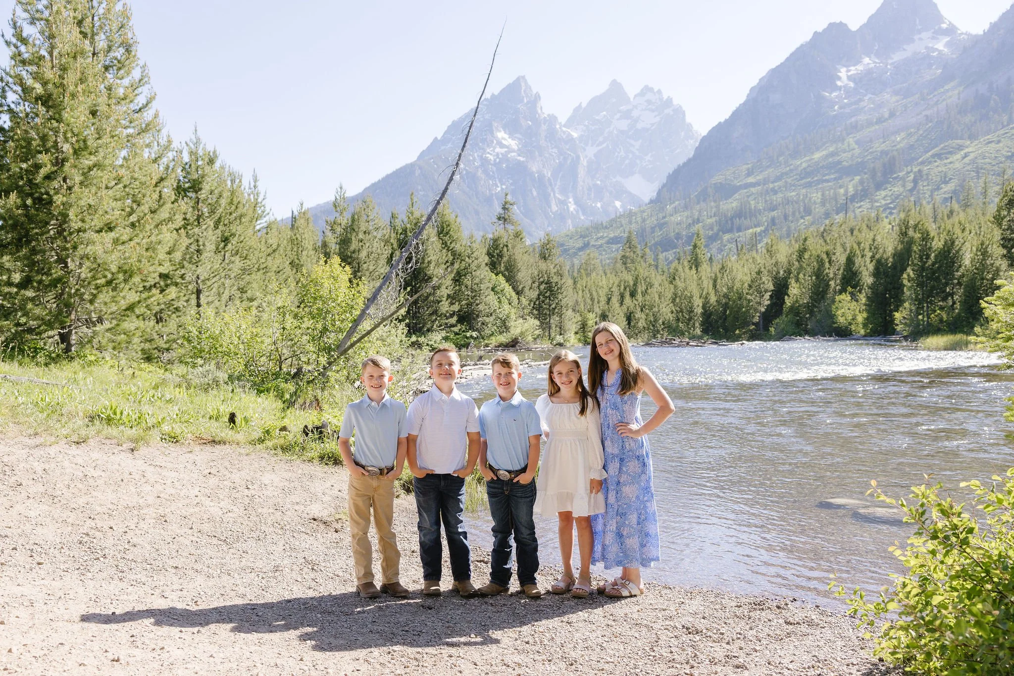  Family takes portraits with local photographer during their stay at the Four Seasons Resort Jackson Hole Teton Village. 