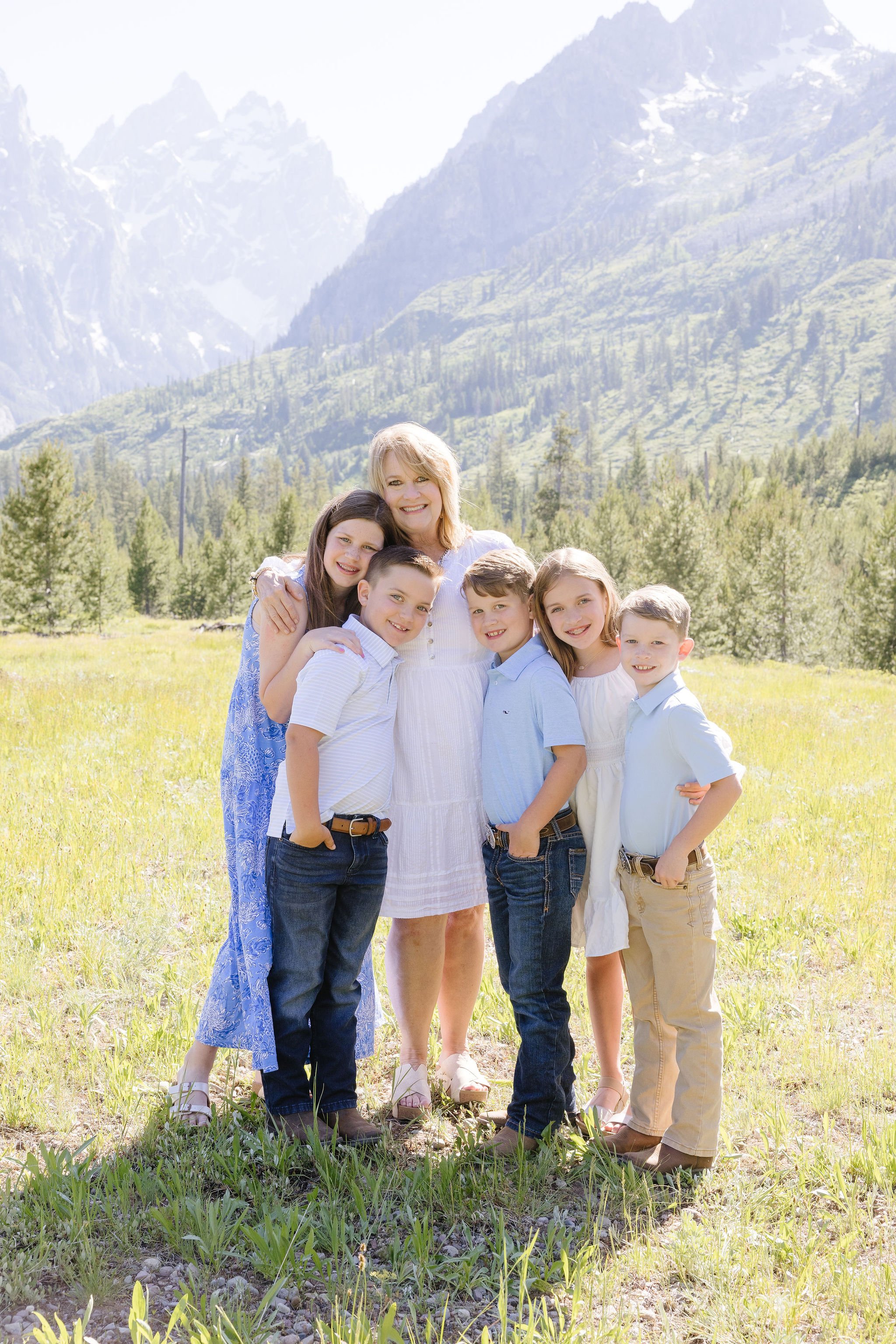  Family takes portraits with local photographer during their stay at the Four Seasons Resort Jackson Hole Teton Village. 
