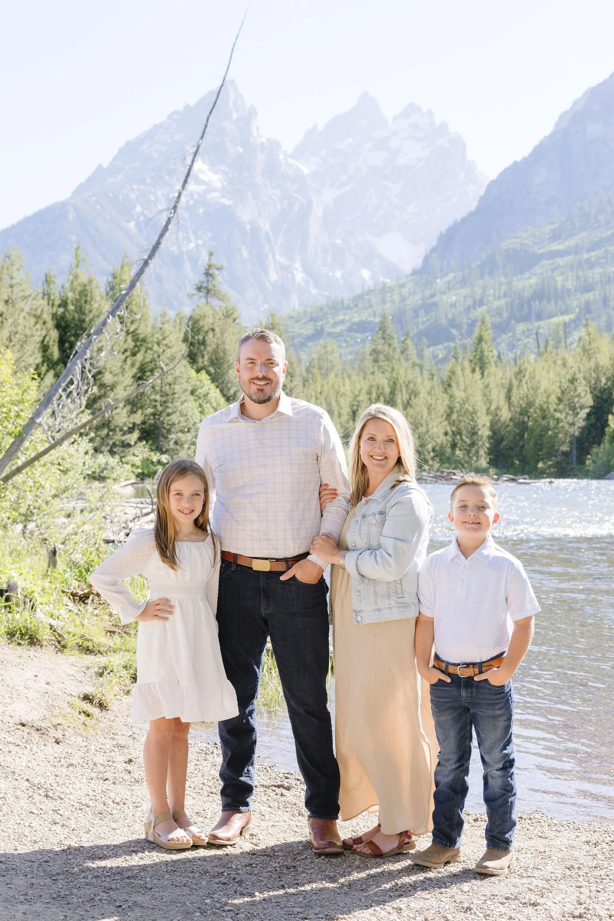  Family takes portraits with local photographer during their stay at the Four Seasons Resort Jackson Hole Teton Village. 