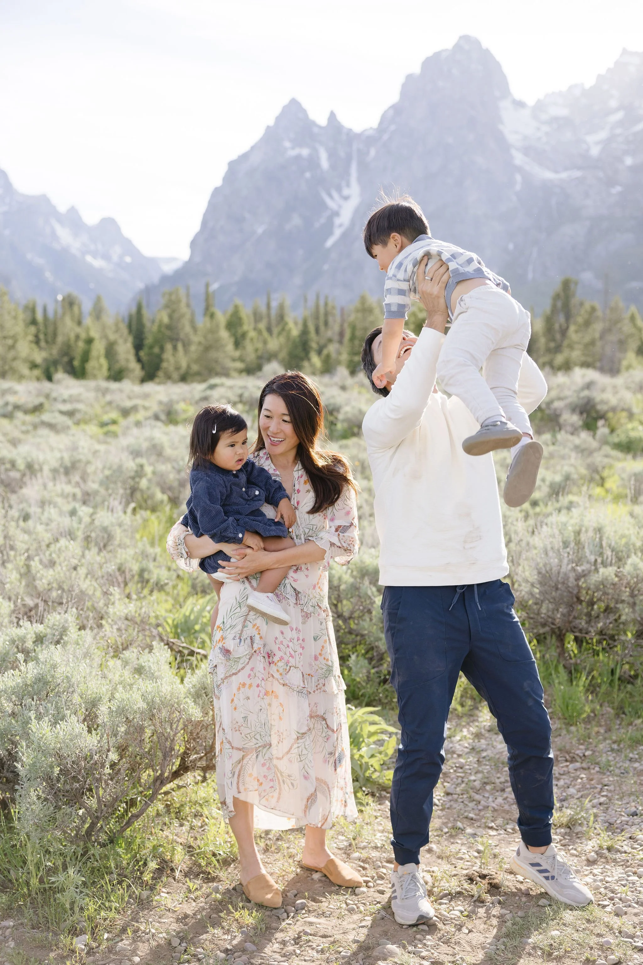  Photographer captures beautiful printed and navy summer family photo outfits that look great in the Tetons. 