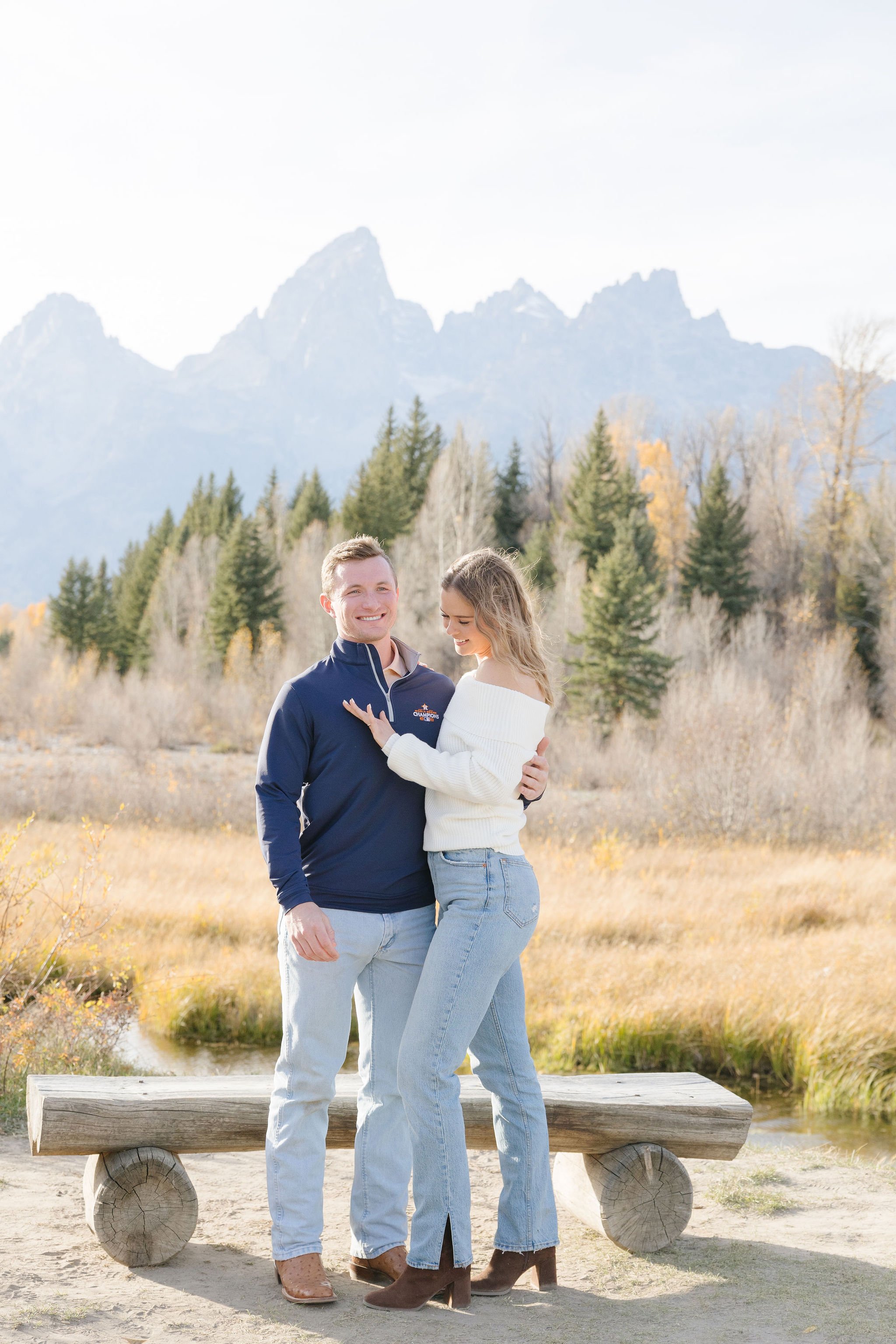 Woman admires the ring her boyfriend just proposed to her with in the Tetons. 
