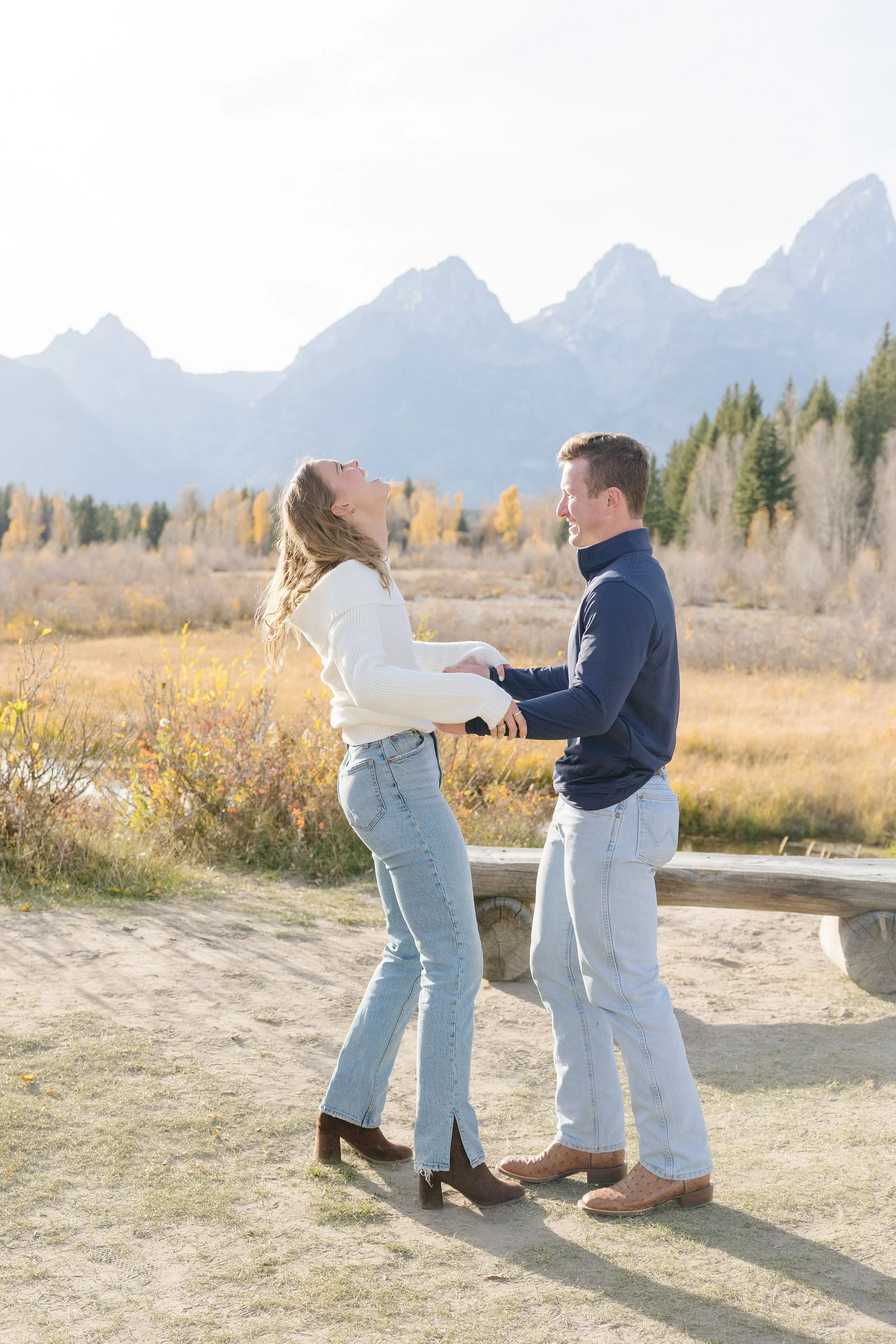  Jackson Hole proposal photographer captures pure excitement of woman as her boyfriend is about to get down on one knee. 