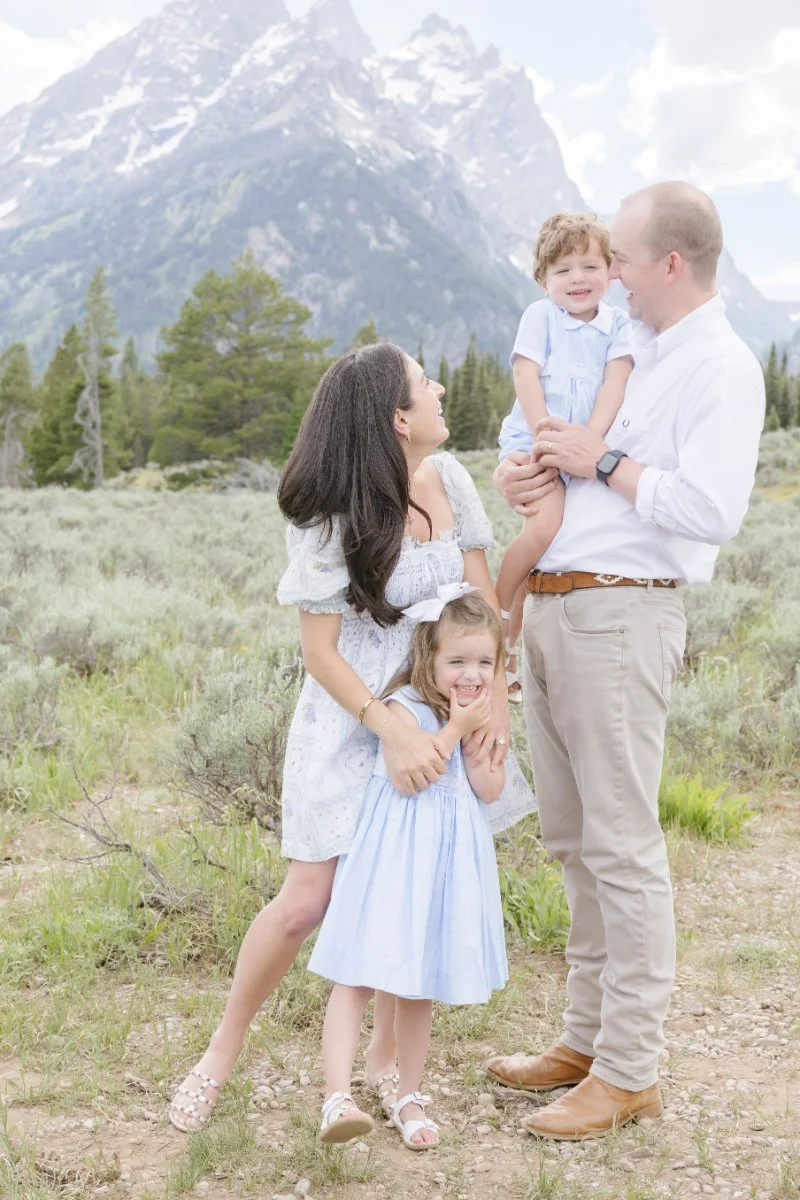  Family poses for photo together as they stop for a break as they are driving the legendary going-to-thesun road Montana 